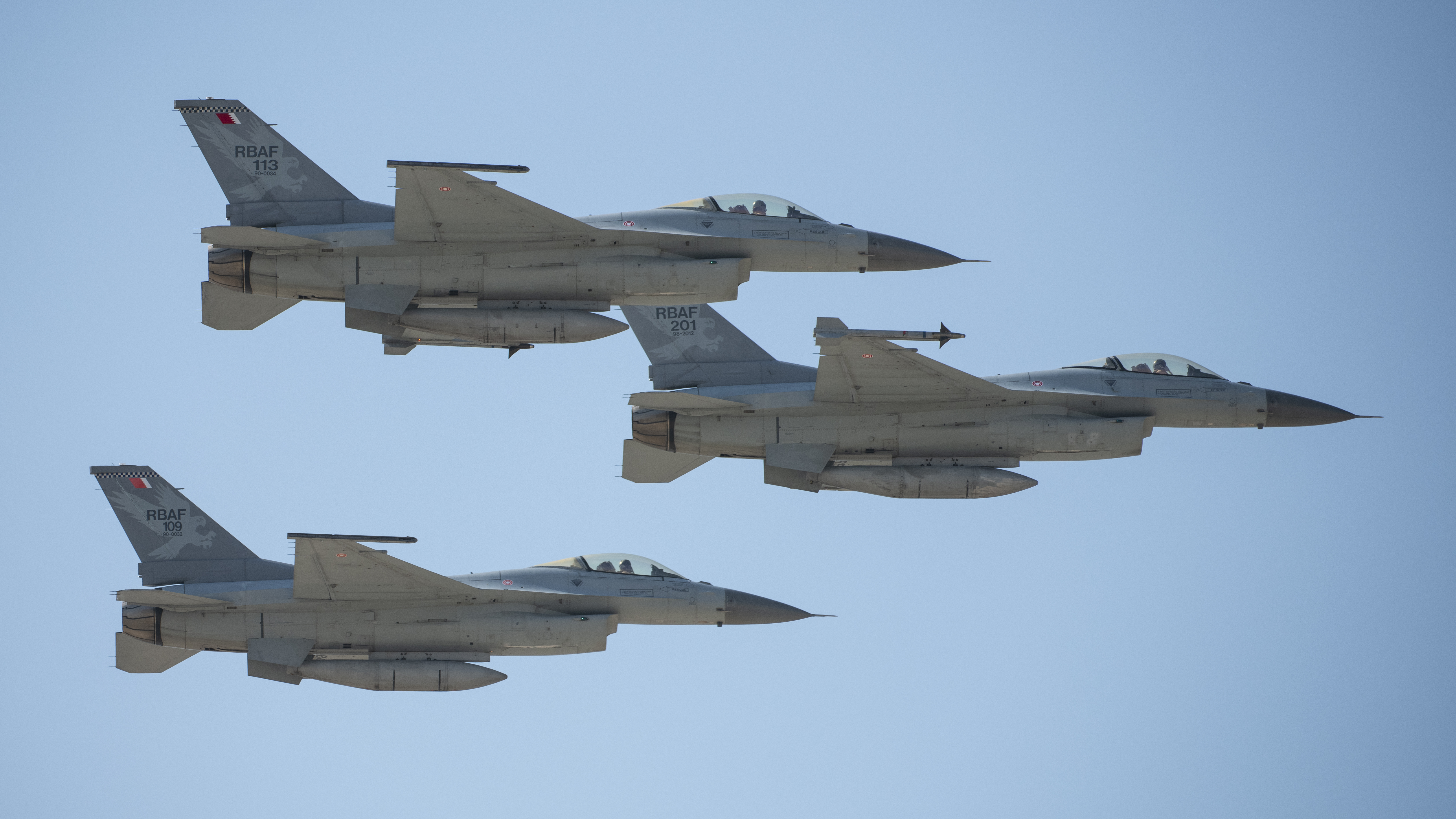 Royal Bahraini Air Force F-16 Fighting Falcons conduct a formation flyover during the Bahrain International Airshow, at Sakhir Air Base, Bahrain, Nov. 15, 2024. Bahrain's security partnership with the U.S. extends beyond the region, as demonstrated by their 30-year involvement in the F-16 fighter jet program. Bahrain is the first in the world to fly the newest and most advanced version, the F-16 Block 70, which arrived in March 2023. (U.S. Air Force photo by Tech. Sgt. Peter Reft)