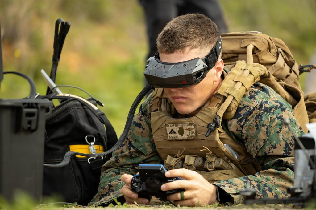 U.S. Marine Corps Lance Cpl. Corey Ashby, a small unmanned aircraft system operator with 3rd Light Armored Reconnaissance Battalion, 1st Marine Division, pilots a first-person view sUAS during a live fire demonstration rehearsal at Marine Corps Base Camp Pendleton, California, Jan. 28, 2026. I Marine Expeditionary Force, in partnership with Defense Innovation Unit, evaluated fiber-optic drones for use in signal-degraded environments. (U.S. Marine Corps photo by Cpl. Joshua Bustamante)
