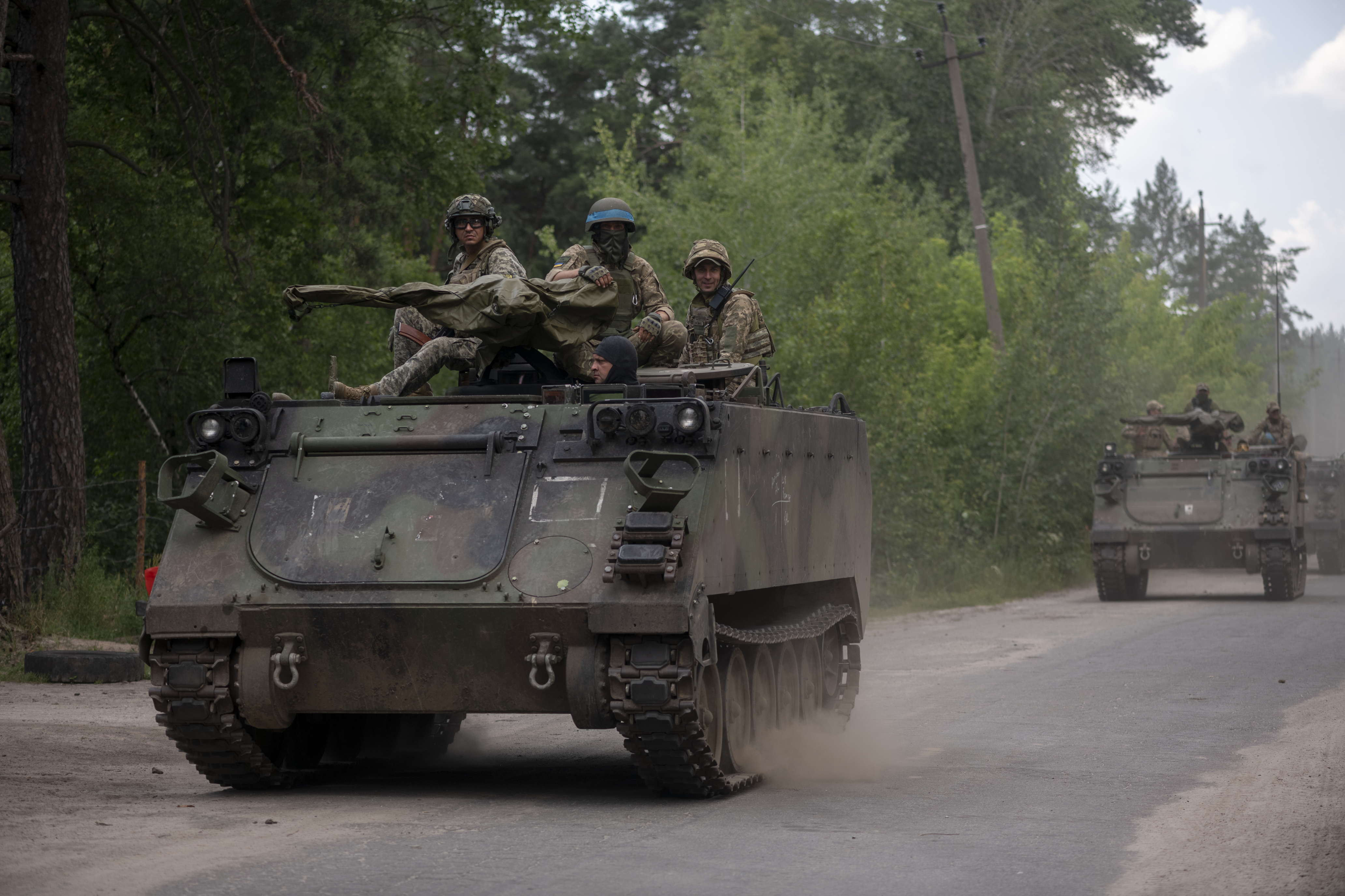 DONETSK OBLAST, UKRAINE - JULY 4: Ukrainian soldiers exit on the M113 armored personnel carriers in a column for tasks on a military outdoor firing range during exercises on July 4, 2023 in Donetsk Oblast, Ukraine. (Photo by Viktor Fridshon/Global Images Ukraine via Getty Images)