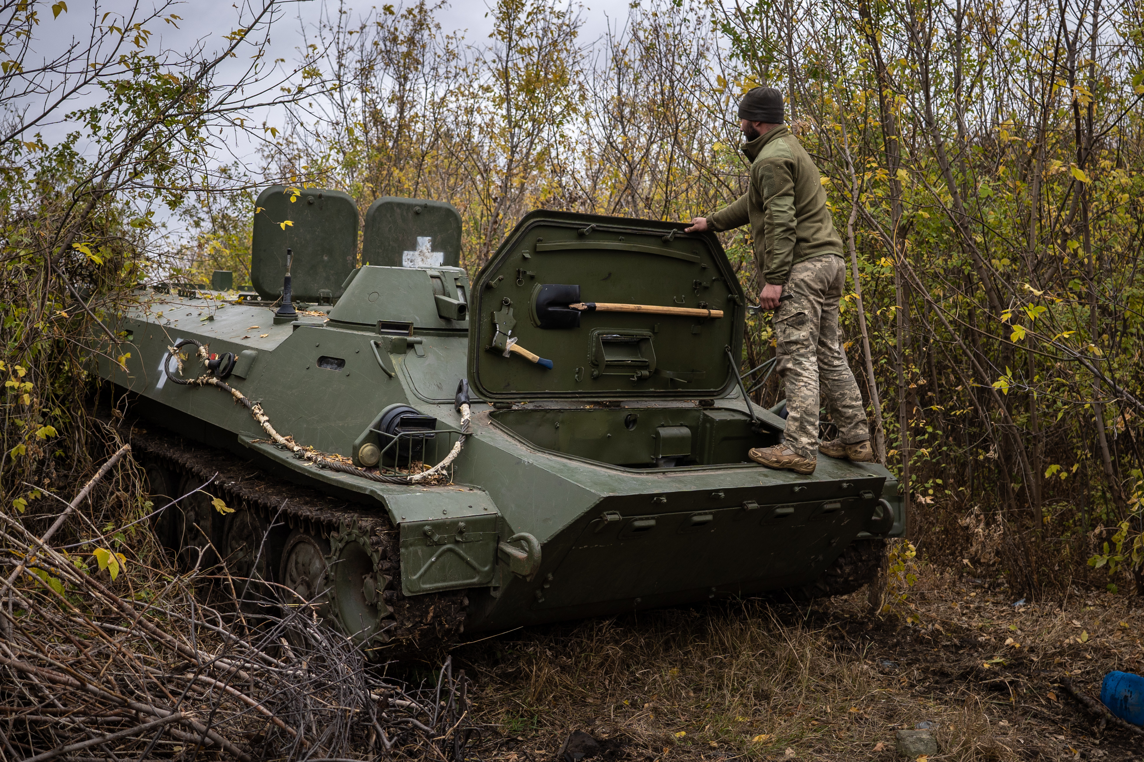 KHARKIV, UKRAINE - OCTOBER 25: Two Ukrainian army mechanics repair a broken MT-LB (light armored multi-purpose towing vehicle) in the Donetsk region in Kharkiv, Ukraine on October 25, 2024. Originally designed in the 1960s during the Soviet era, the vehicle entered service a decade later and was manufactured in Kharkiv. (Photo by Fermin Torrano/Anadolu via Getty Images)