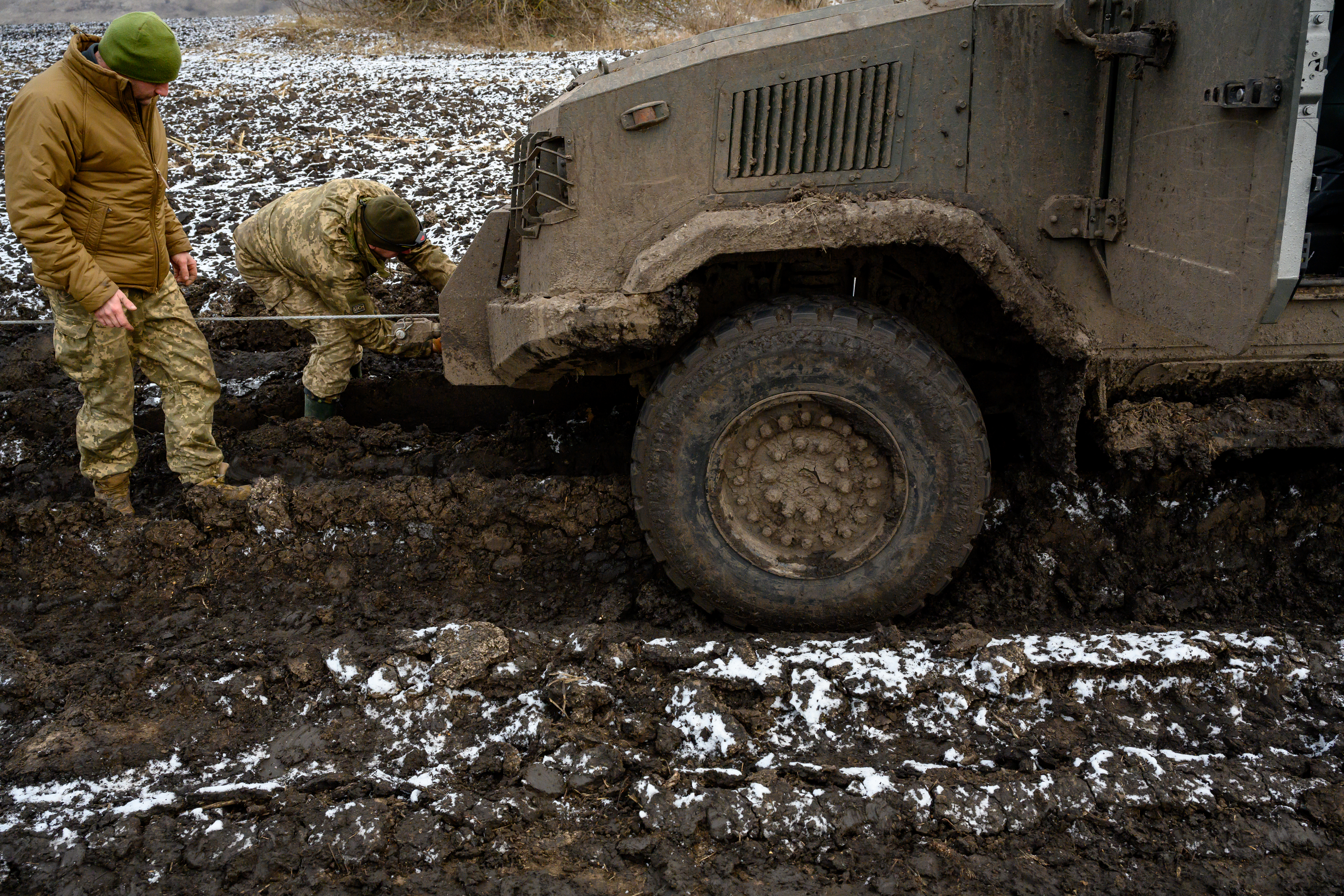 SUMY, UKRAINE - JANUARY 15: A Ukrainian Kozak armored vehicle gets stuck in black soil mud, on its way from positions of American Bradley Fighting Vehicles used during Ukraines on-going cross-border operation into Russias Kursk region, where Ukrainians have fought both Russians and an estimated contingent of 12,000 North Korean troops, on January 15, 2025 in Sumy, Ukraine. Ukrainian officers of the 4th Company, 1st Battalion, 82nd Separate Air Assault Brigade say that this American military hardware has been crucial to their ability to cross into Russia last August, as well as to Ukraines border defense against Russias all-out invasion in February 2022. Senior Ukrainian commanders and officials have expressed concern that deep U.S. military and financial support will ease up or stop with the incoming Trump Administration, which has stated that it would swiftly end the three-year war. (Photo by Scott Peterson/Getty Images)