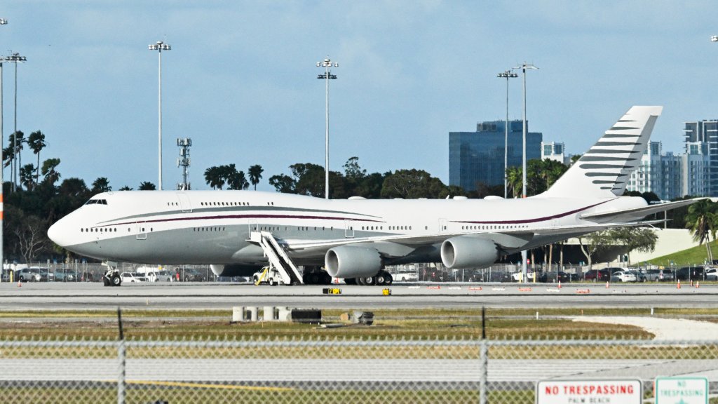 In this February 15, 2025 a Qatari Boeing 747 sits on the tarmac of Palm Beach International airport after US President Donald Trump toured the aircraft on February 15, 2025. Donald Trump plans to accept a luxury Boeing jet from the Qatari royal family for use as Air Force One and then continue flying in it after his tenure, despite strict rules on US presidential gifts, media reported May 11, 2025. Calling the plane a "flying palace," ABC News, which first reported the story, said the Boeing 747-8 jumbo jet would possibly be the most expensive gift ever received by the American government. (Photo by ROBERTO SCHMIDT / AFP) (Photo by ROBERTO SCHMIDT/AFP via Getty Images)
