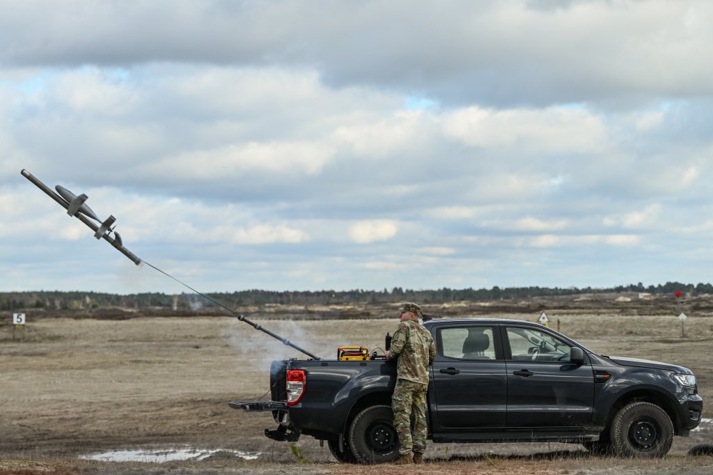 DEBA, POLAND - NOVEMBER 18: A U.S. Army soldier lauches an AS3 Surveyor interceptor drone, part of the U.S. counter-drone system known as 'MEROPS,' during a live-fire demonstration at the Deba training grounds in Subcarpathian Voivodeship, Poland, on November 18, 2025. The exercise is part of Eastern Sentry enhanced vigilance efforts launched in response to recent drone incursions along NATO's eastern flank. (Photo by Artur Widak/Anadolu via Getty Images)