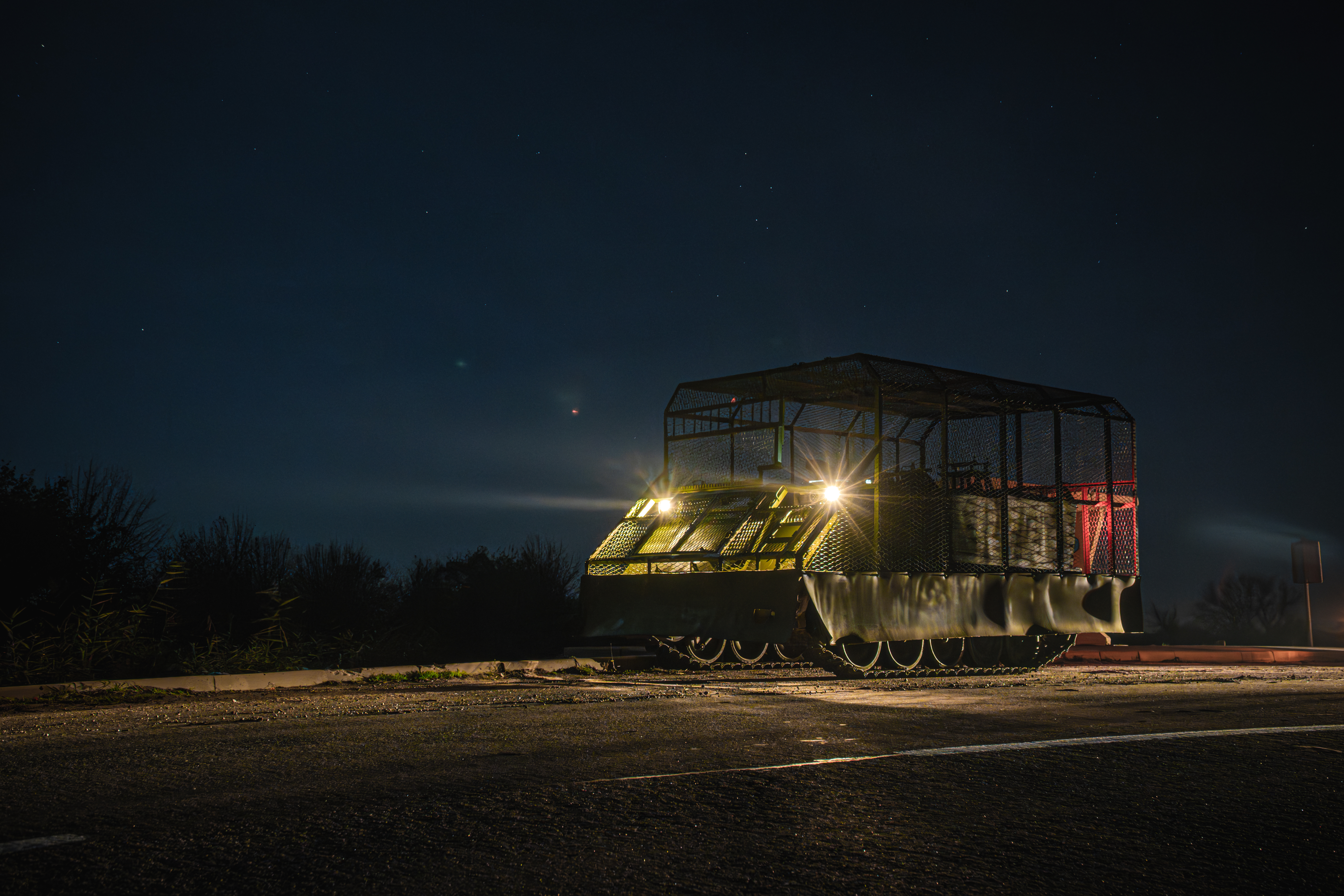 UNSPECIFIED, UKRAINE - NOVEMBER 2: Soldiers of the Połk Kalinoŭskaha (Kastuś Kalinoŭski Regiment) reload tracked vehicles at night on November 2, 2025 in Unspecified, Ukraine. The Kastuś Kalinoŭski Regiment is a group of Belarusian opposition volunteers, which was formed during the Russian-Ukrainian war to defend Ukraine against the Russian invasion in 2022. The unit is armed with armored personnel carriers: the US M113 and the British FV103 Spartan. All vehicles are equipped with protection against drones. The main task is logistics on the front line: delivering soldiers to the front line, rotating groups and transporting ammunition. This vehicle also takes the wounded from the battlefield directly under heavy enemy fire. (Photo by Sushchyk Kanstantsin/Global Images Ukraine via Getty Images)