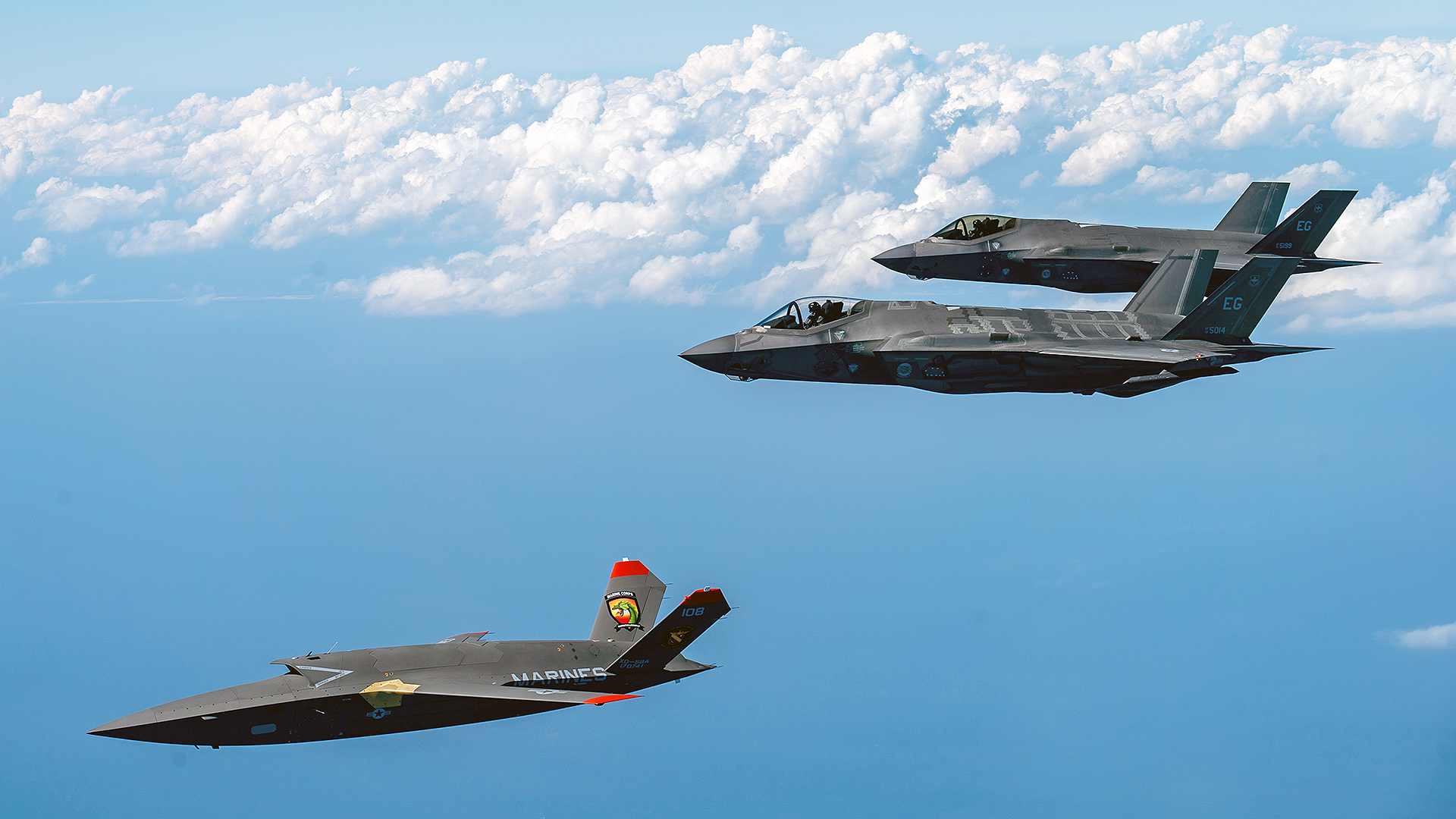 A U.S. Marine Corps XQ-58A Valkyrie, highly autonomous, low-cost tactical unmanned air vehicle, conducts its second test flight with two U.S. Air Force F-35A Lightning II aircraft assigned to 33rd Fighter Wing, 96th Test Wing at Eglin Air Force Base, Fla., Feb. 23, 2023. The XQ-58A Valkyrie test flight and the data collected inform future requirements for the Marine Corps in a rapidly evolving security environment, while successfully fueling joint innovation and experimentation opportunities. (U.S. Air Force photo by Master Sgt. John McRell)