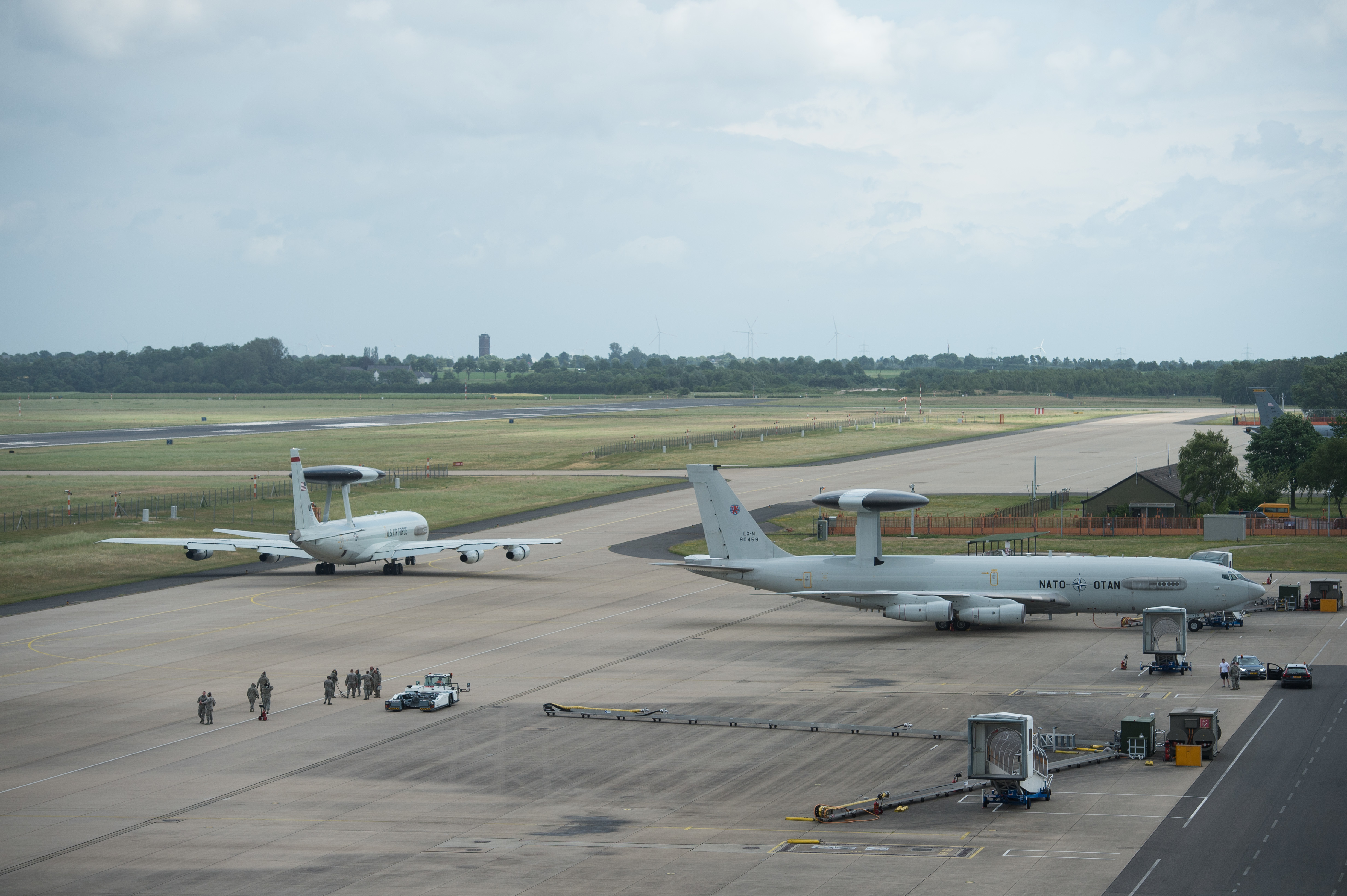 A U.S Air Force E-3 Sentry taxis past a NATO E-3A Airborne Warning and Control System aircraft on June 7, 2017, at NATO Air Base Geilenkirchen, Germany. The aircraft and nearly 100 reservists from the 513th Air Control Group are deployed in support of BALTOPS 2017, which is the first time a U.S. E-3 Sentry has supported a NATO exercise in 20 years. (U.S. Air Force photo/2nd Lt. Caleb Wanzer)