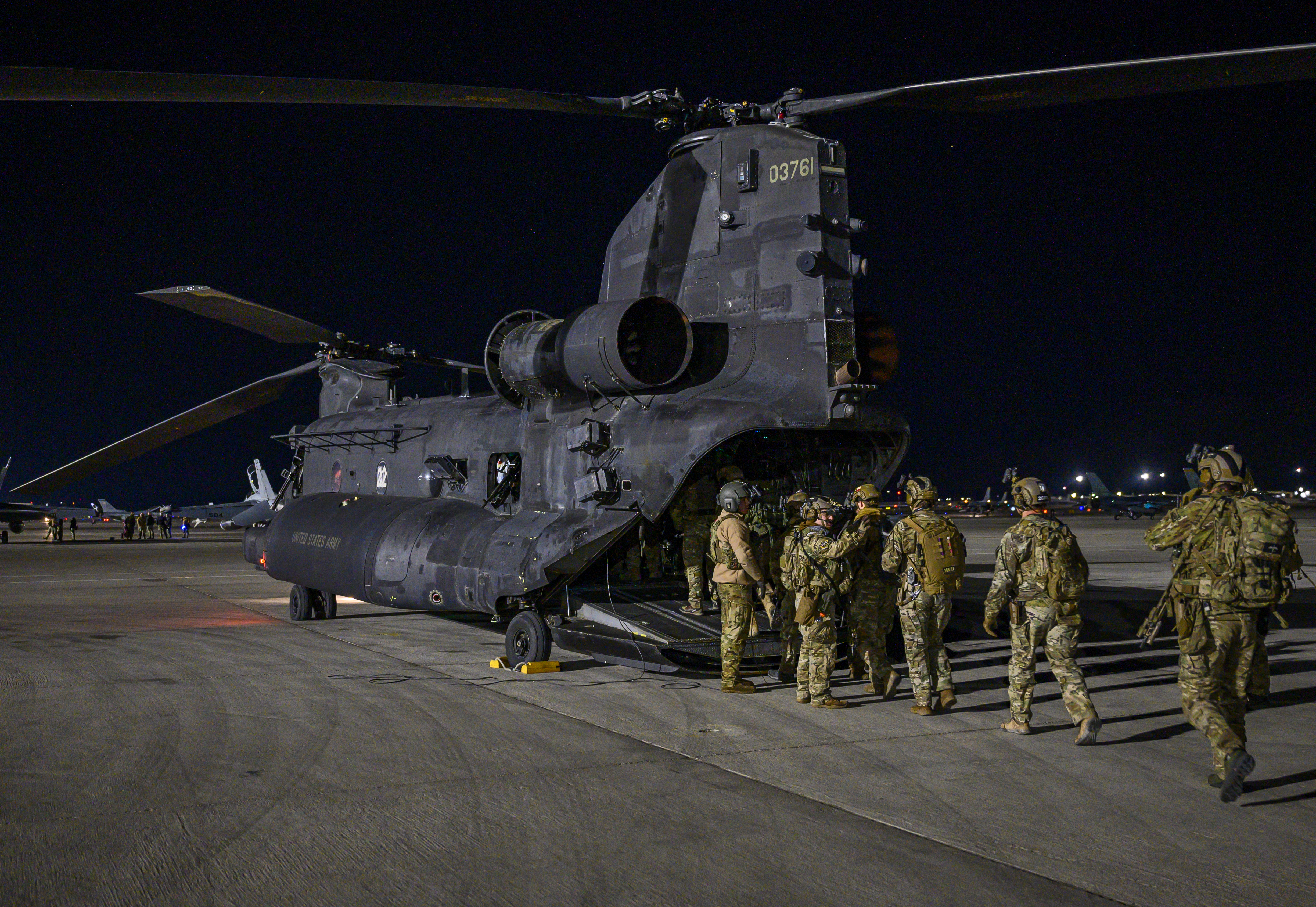 U.S. Army Soldiers enter an MH-47G Chinook helicopter assigned to the 3rd Battalion, 160th Special Operations Aviation Regiment at Hunter Army Airfield, Georgia, before it takes-off during Weapons School Integration (WSINT) at Nellis Air Force Base, Nevada, Dec. 2, 2020. U.S. Army units came together during WSINT to support the exercise by simulating scenarios of current and future threats. (U.S. Air Force photo by Airman 1st Class Dwane R. Young) 