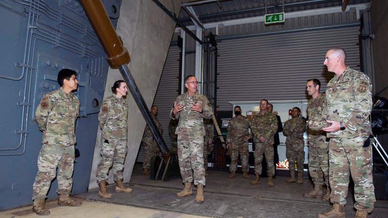 U.S. Air Force Maj. Gen. Tom Wilcox II, center, Air Force Installation and Mission Support Center commander, talks with Airmen at the 423rd Security Forces Squadron bunker shoot house training location at Royal Air Force Molesworth, England, Sept. 29, 2021. The AFIMSC leadership visited the 501st Combat Support Wing and its mission partners at the U.S. European Command Joint Intelligence Operations Center Europe Analytic Center at RAF Molesworth, England. The AFIMSC provides base communications, civil engineering, security forces and logistics support that assist the 501st CSW in fulfilling its mission. (U.S. Air Force photos by Senior Airman Jennifer Zima)