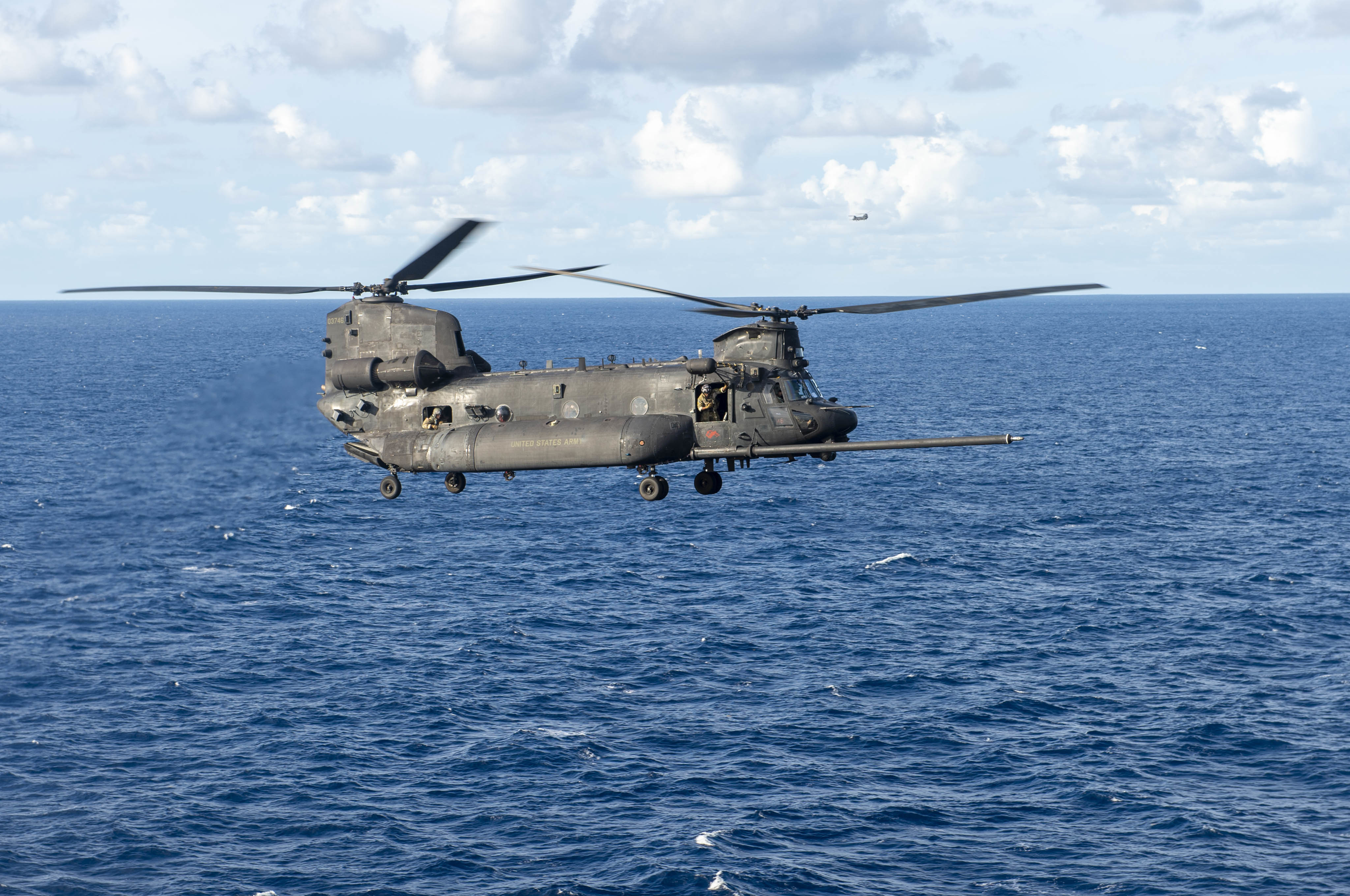 211005-N-PA358-2018 ATLANTIC OCEAN (Oct. 5, 2021) An MH-47G Chinook, attached to the 3rd Battalion, 160th Special Operations Aviation Regiment (3/160th SOAR), flies near the flight deck of the Nimitz-class aircraft carrier USS Harry S. Truman (CVN 75). Truman is operating in the Atlantic Ocean in support of naval operations to maintain maritime stability and security in order to ensure access, deter aggression and defend U.S., allied and partner interests. (U.S. Navy Photo by Mass Communication Specialist Seaman T'ara Tripp)