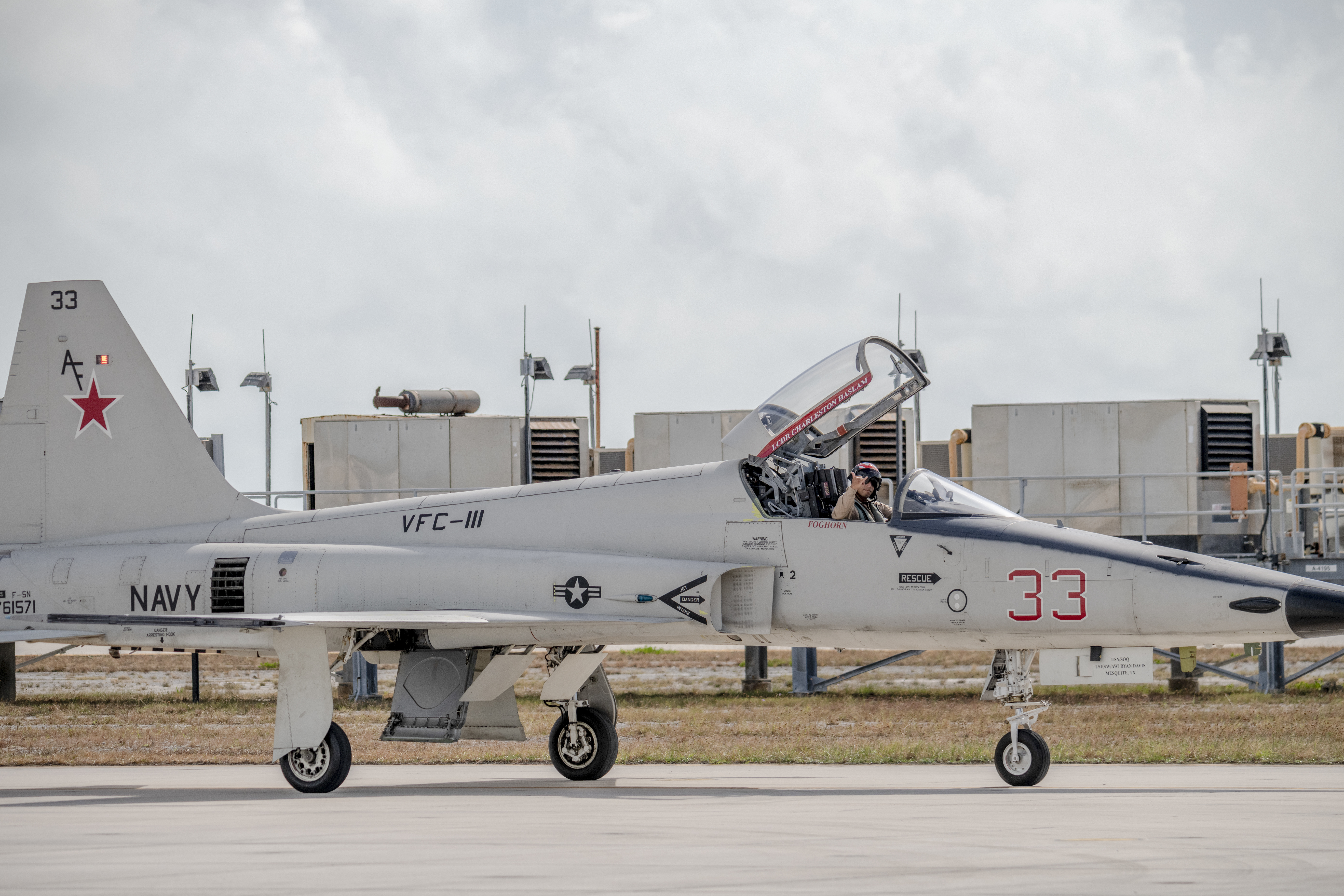 U.S. Navy Lt. Yhanic Braithwaite, an F-5 fighter pilot assigned to the Fighter Squadron Composite (VFC) 111, taxis across the flightline in an F-5N Tiger II, assigned to the VFC-111, after a training flight with the Ohio National Guard’s 180th Fighter Wing at Naval Air Station Key West, Fla., Nov. 2, 2022. The Ohio National Guard’s 180th Fighter Wing deployed to NAS Key West to train with VFC-111, the Navy's premier adversary squadron, providing realistic training scenarios that ensure the 180FW is prepared for homeland defense and contingency operations around the globe. (U.S. Air National Guard photo by Staff Sgt. Kregg York)