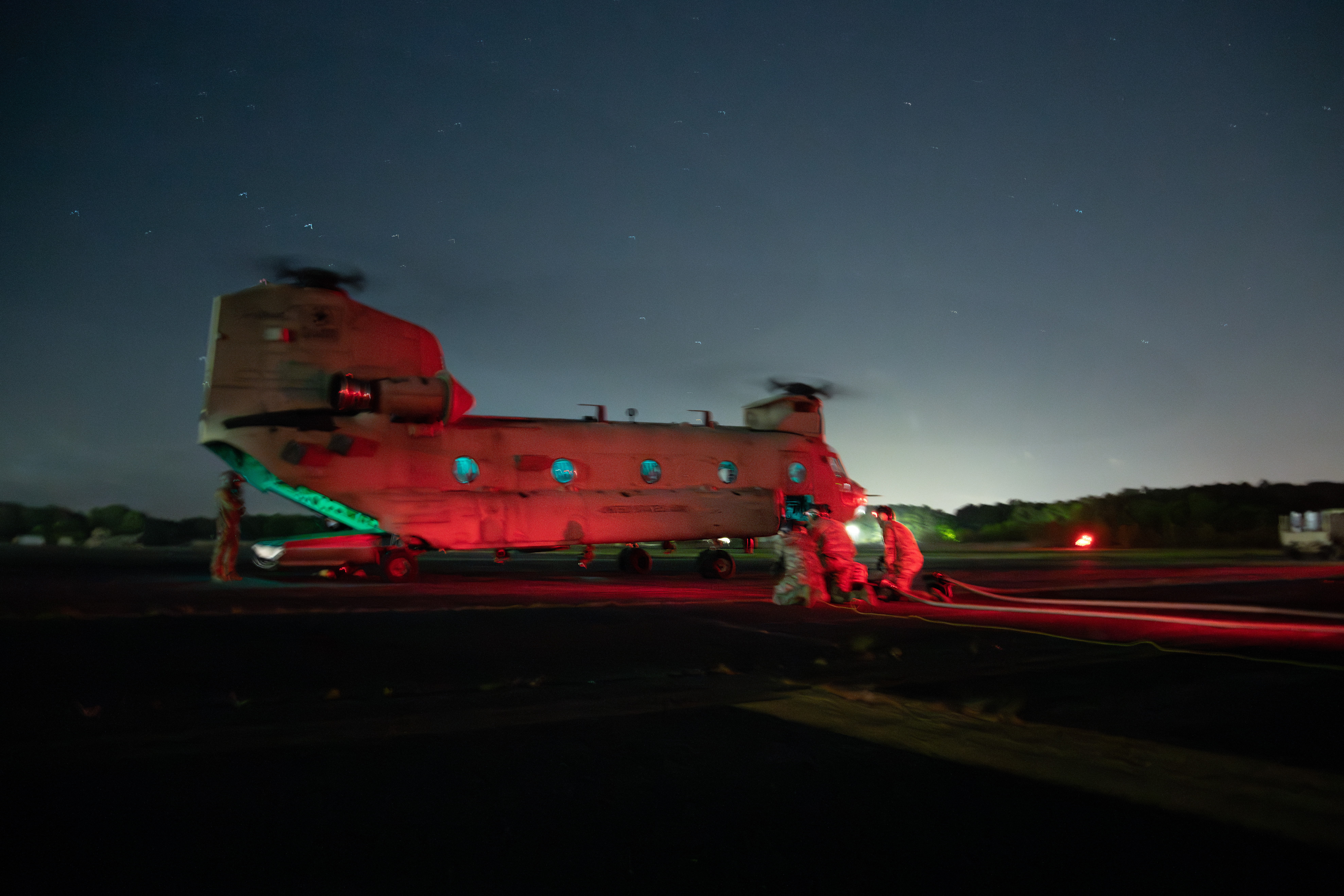 JOINT BASE LANGLEY- EUSTIS, Va. – U.S. Soldiers assigned to Echo Company, 5-159th General Support Aviation Battalion (GSAB), refuel a CH-47 Chinook helicopter during a Forward Arming and Refueling Point (FARP) training at Felker Army Airfield on Joint Base Langley-Eustis, Virginia, April 25, 2024. FARP training enables soldiers to gain experience providing fuel and ordinance necessary for rotary wing operations. (U.S. Air Force photo by Zulema Sotelo)