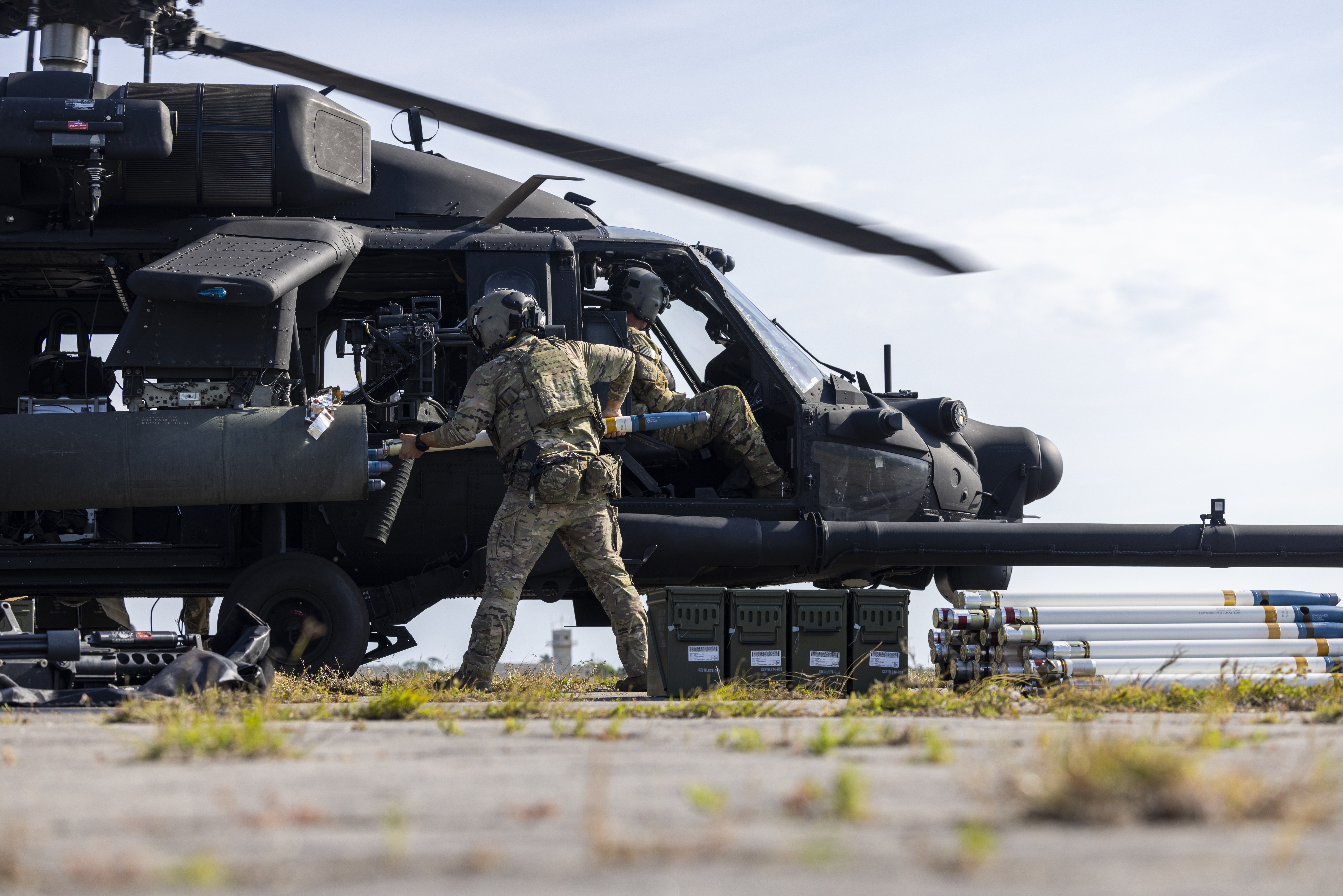 A U.S. Army Soldier assigned to the 160th Special Operations Aviation Regiment loads rockets into a MH-60 Black Hawk during a forward arming and refueling point exercise at Marine Corps Outlying Field Atlantic, May 6, 2025. U.S. Army Soldiers and aircraft from the 160th SOAR utilized MCAS Cherry Point’s training area to conduct a FARP. This training is essential for enhancing the unit’s operational readiness and ensuring efficient support for rapid deployment, as Cherry Point provides the facilities and resources to simulate real world scenarios (U.S. Marine Corps photo by Cpl. Matthew Williams)