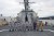 250911-N-CV021-1040 SUBIC BAY, Philippines (Sep. 11, 2025)—Sailors aboard the Arleigh Burke-class guided-missile destroyer USS John Finn (DDG 113), Sailors from the Philippine Navy and Cmdr. Noriyuki Kawahata, Assistant Defense Attaché of Japan to the Philippines, pose for a picture on the fo’c’sle during a subject matter exchange as part of the multi-lateral Maritime Cooperative Activity in Subic Bay, Philippines, Sep. 11. John Finn is forward-deployed and assigned to Destroyer Squadron (DESRON) 15, the Navy’s largest DESRON and the U.S. 7th Fleet’s principal surface force. (U.S. Navy photo by Mass Communication Specialist 2nd Class Alexandria Esteban)