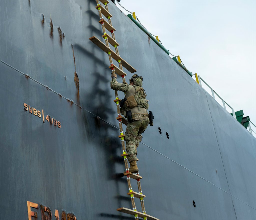 Coast Guard Petty Officer 1st Class Giordano Rodriguez, a maritime enforcement specialist assigned to Coast Guard Port Security Unit 301, climbs a Jacob’s ladder to board an oil tanker vessel for a large vessel security boarding off the coast of San Pedro, California, April 8, 2026. Large vessel security boardings are a critical component of the U.S. Coast Guard's mission to ensure the safety and security of our nation's maritime interests and are essential for protecting our ports and waterways from a variety of threats. (U.S. Coast Guard photo by Petty Officer 3rd Class Roberto A. Nieves Felix)