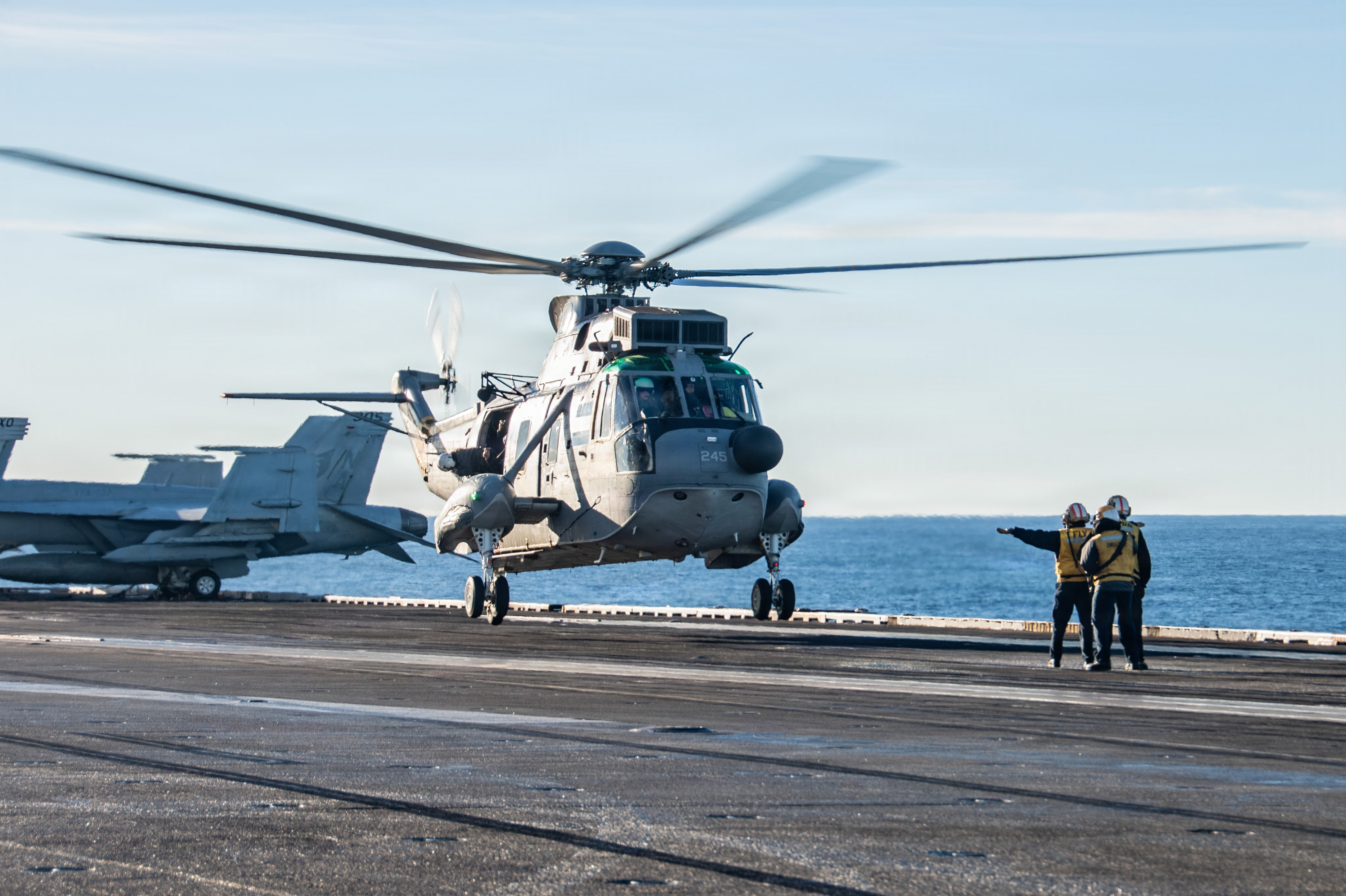 An Argentine Navy SH-3 Sea King, attached to 2da Escuadrilla Aeronaval de Helicopteros (EAH) 2 lands on the flight deck of Nimitz-class aircraft carrier USS Nimitz (CVN 68) for a subject matter expert knowledge exchange and embark between U.S. and Argentine service members held onboard the Nimitz while the ship is underway in the Atlantic Ocean, April 28, 2026. Nimitz is deployed as part of Southern Seas 2026 which seeks to enhance capability, improve interoperability, and strengthen maritime partnerships with countries throughout the region through joint, multinational and interagency exchanges and cooperation. (U.S. Navy photo by Mass Communication Specialist 2nd Class Jaron Wills)