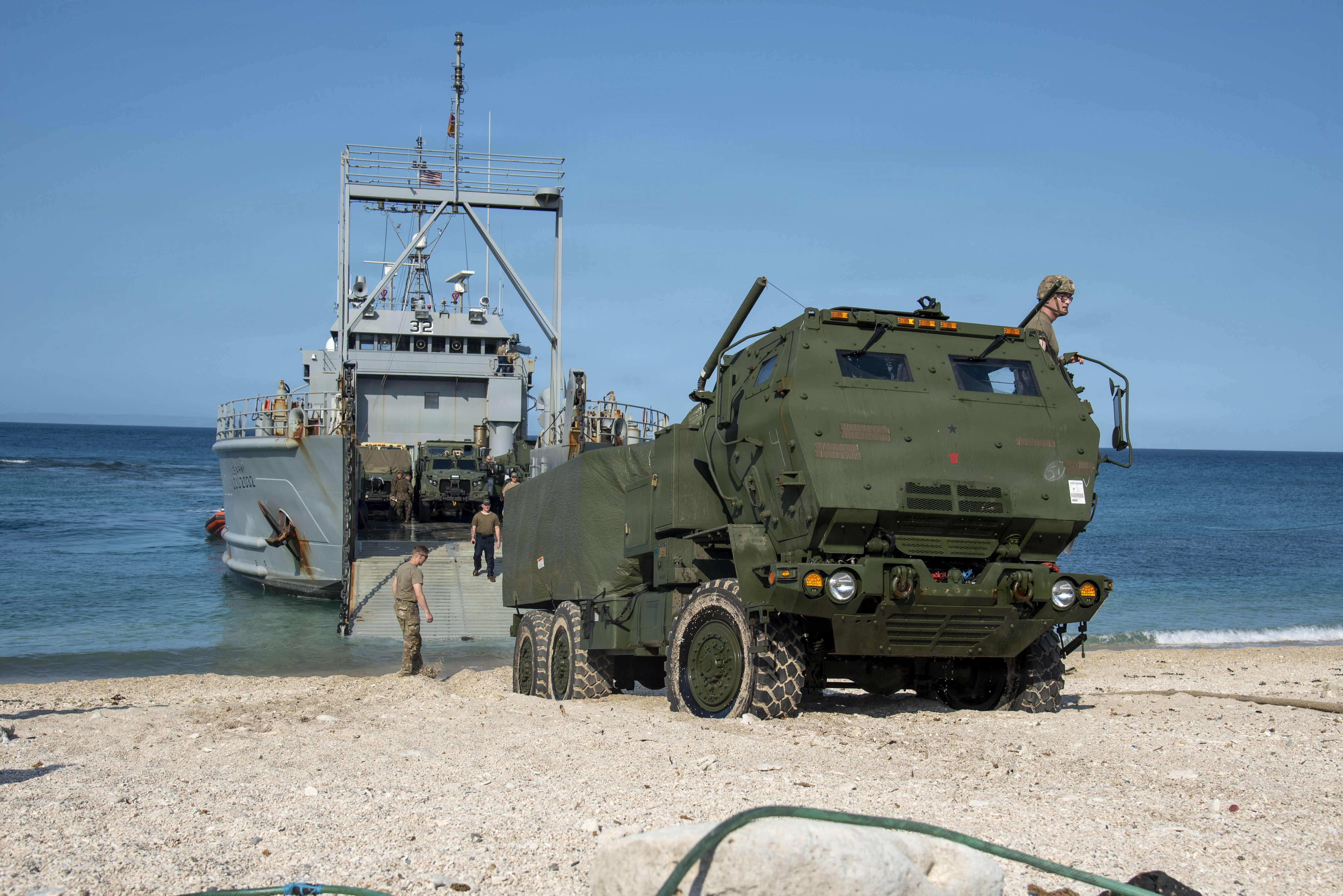 U.S. Marines with 3rd Littoral Combat Team, 3rd Marine Littoral Regiment, 3rd Marine Division, and U.S. Army Soldiers with 7th Infantry Division, Multi-Domain Command - Pacific, guide an M142 High Mobility Artillery Rocket System off a U.S. Army Landing Craft Utility during a ship-to-shore movement for Exercise Balikatan 2026 at Calayan, Cagayan, Philippines, April 28, 2026. Balikatan is a longstanding annual exercise between the Armed Forces of the Philippines and U.S. military that represents the strength of our alliance, improves our capable combined force, and demonstrates our commitment to regional peace and prosperity. (U.S. Marine Corps photo by Cpl. Ernesto Lagunes)