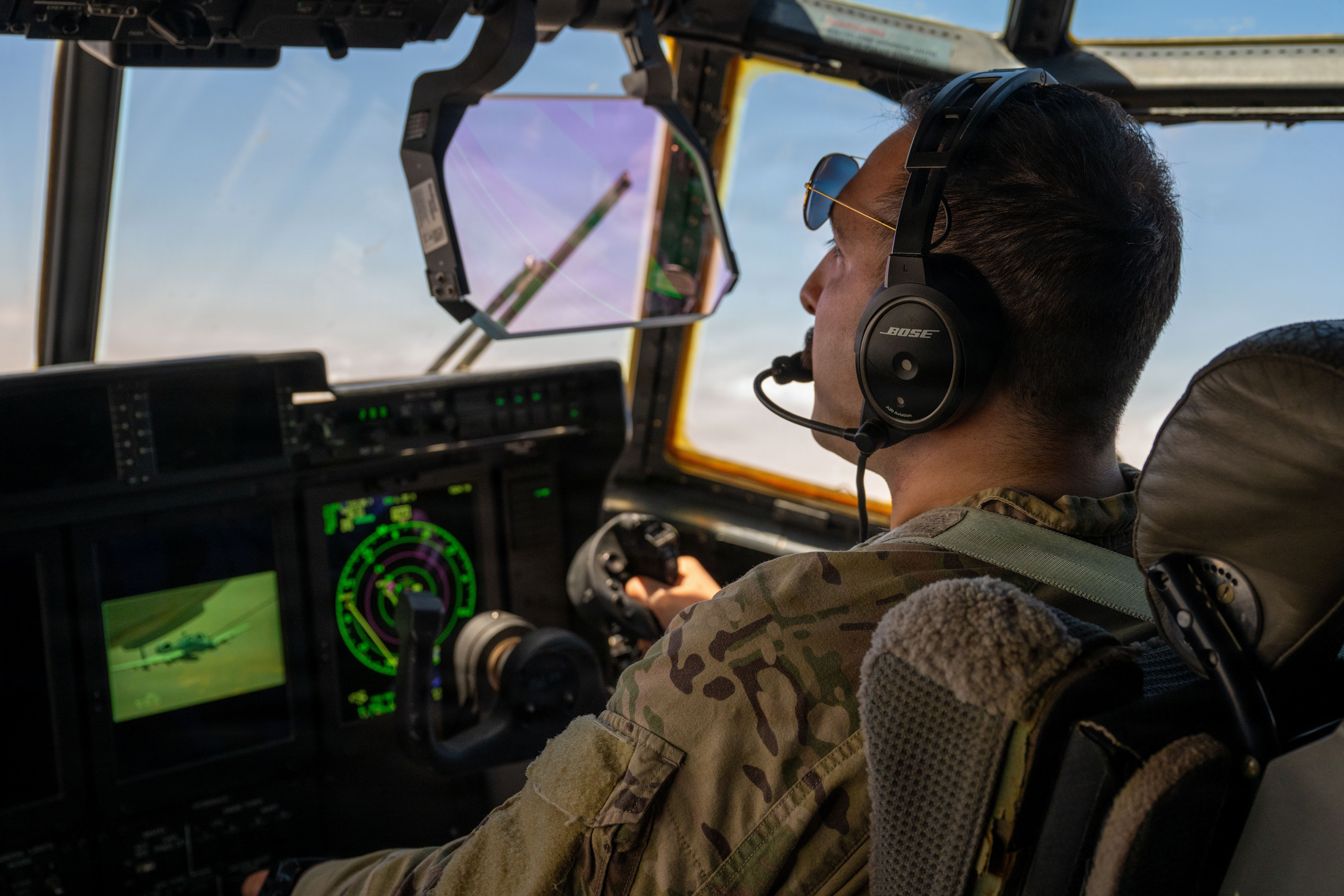 A U.S. Air Force pilot watches an A-10C Thunderbolt II aircraft approach his HC-130J Combat King II aircraft while flying before conducting aerial refueling in the U.S. Central Command area of responsibility, May 9, 2026. (U.S. Air Force photo)