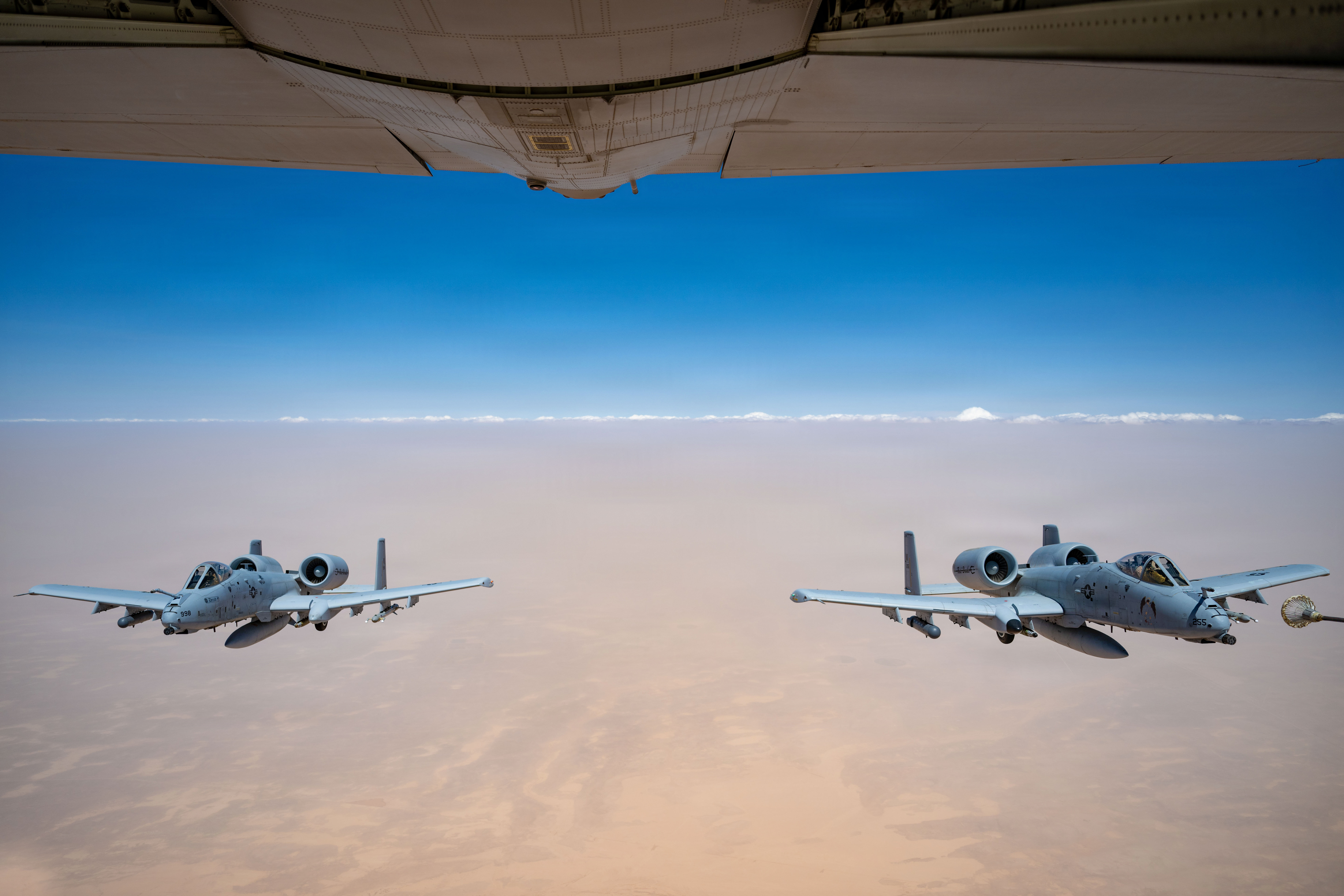 Two U.S. Air Force A-10C Thunderbolt II aircraft approach an HC-130J Combat King II aircraft for aerial refueling in the U.S. Central Command area of responsibility, May 9, 2026. (U.S. Air Force photo)