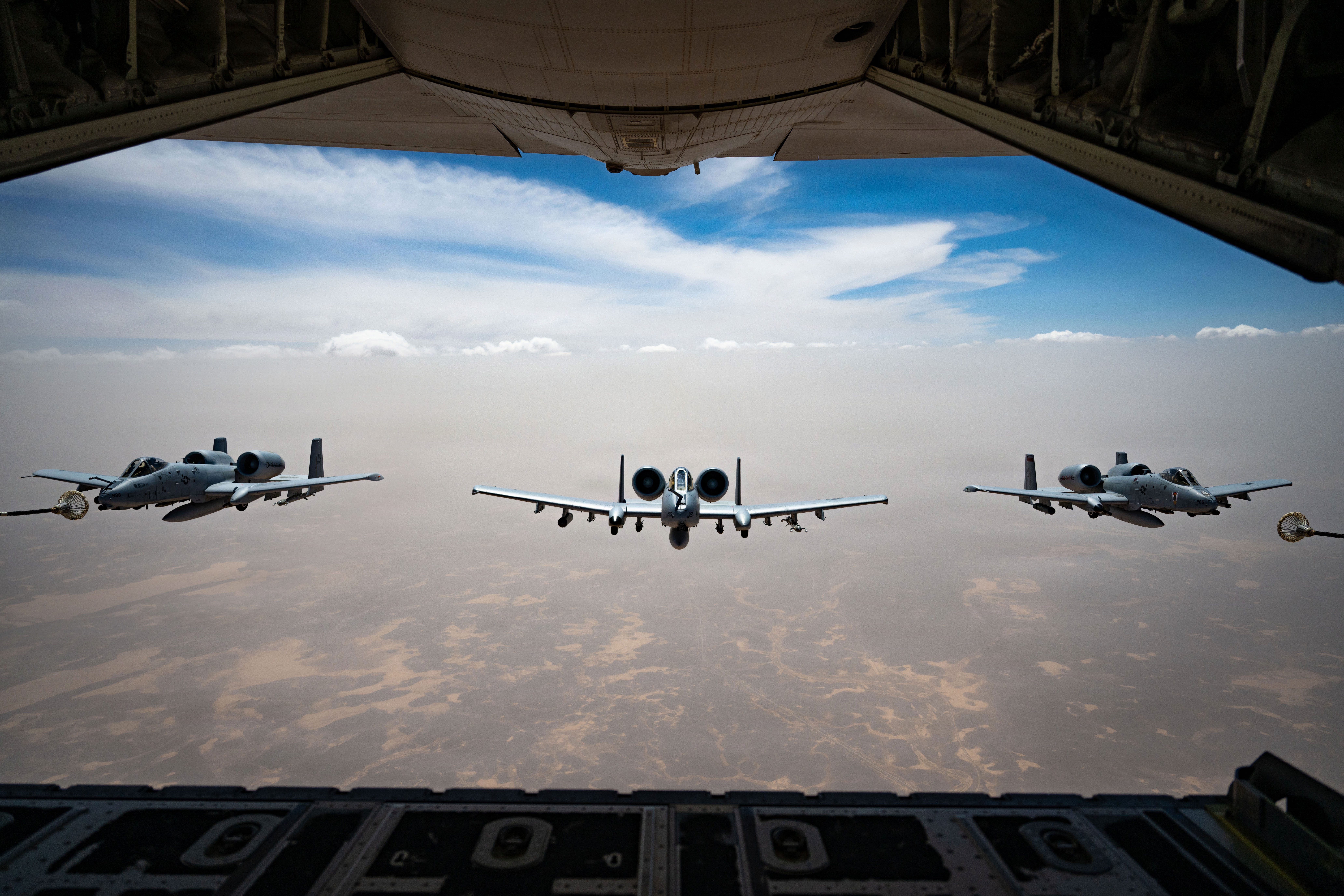 Three U.S. Air Force A-10C Thunderbolt II aircraft fly in formation after aerial refueling from an HC-130J Combat King II aircraft in the U.S. Central Command area of responsibility, May 9, 2026. (U.S. Air Force photo)
