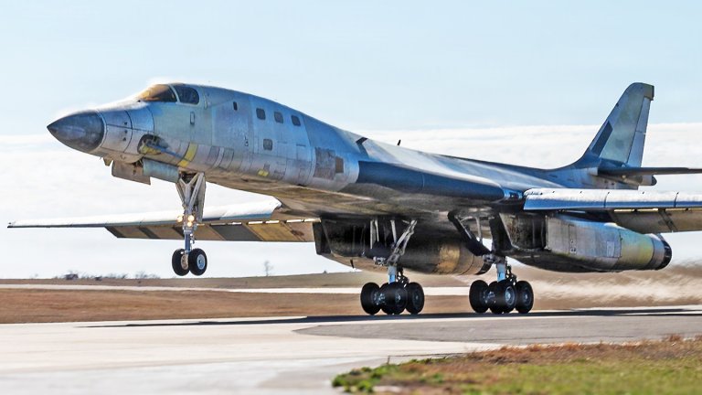 A U.S. Air Force B-1B Lancer performs a functional check flight in a stripped, bare-metal configuration over Tinker Air Force Base, Oklahoma, Feb. 26, 2026. The aircraft was undergoing depot maintenance after being removed from long-term storage and is part of an effort to return the bomber to service.