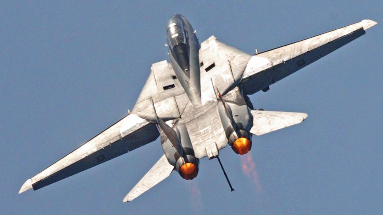 An F-14D Tomcat pulls up after performing a fly-by past the aircraft carrier USS Dwight D. Eisenhower (CVN 69) as the ship operates in the Atlantic Ocean on June 19, 2006.