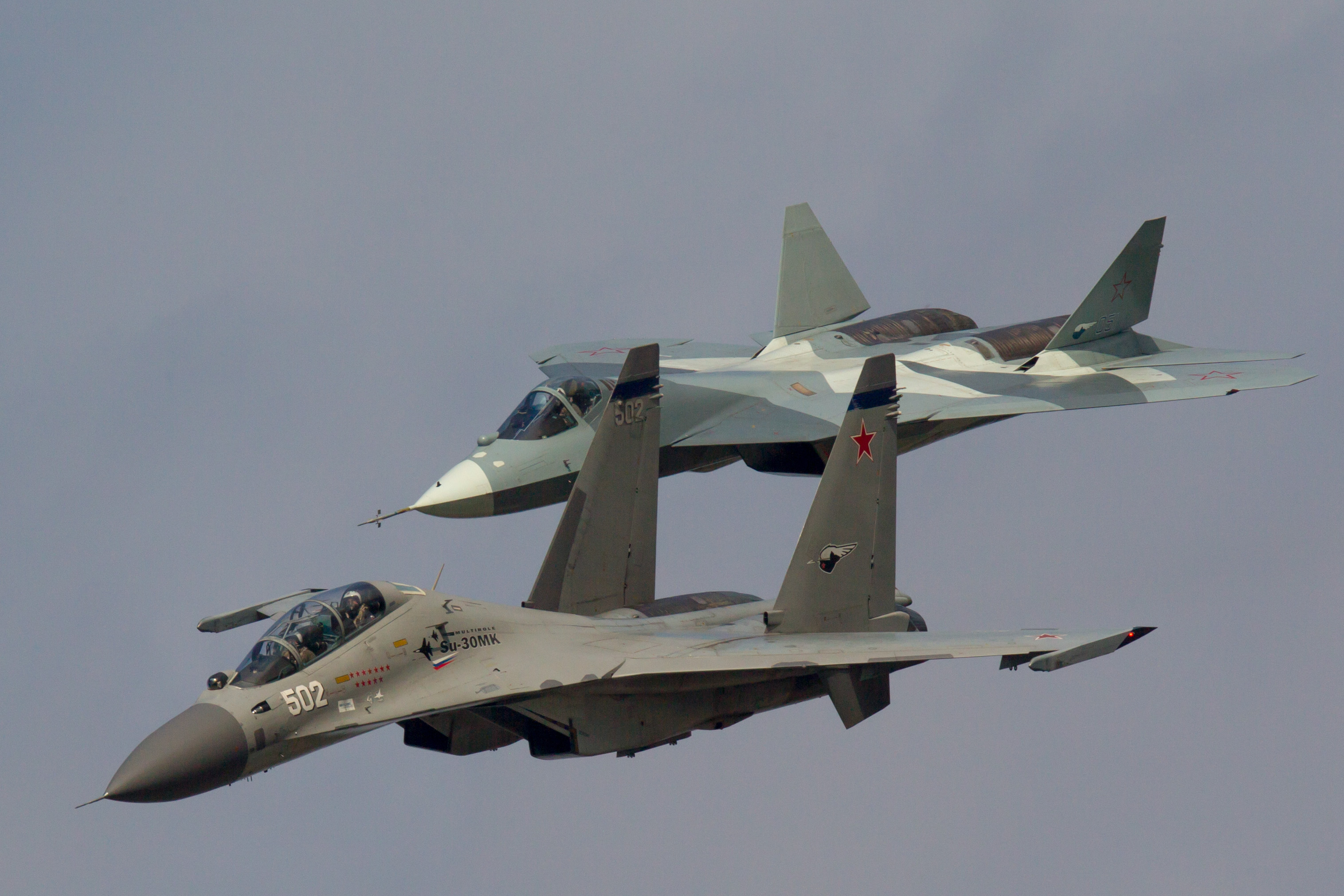 Sukhoi T-50 and Sukhoi Su-30MK jet fighters of Russian Air Force fly in formation at MAKS-2013 International Airshow near Zhukovsky, Russia. (Photo by: aviation-images.com/Universal Images Group via Getty Images)