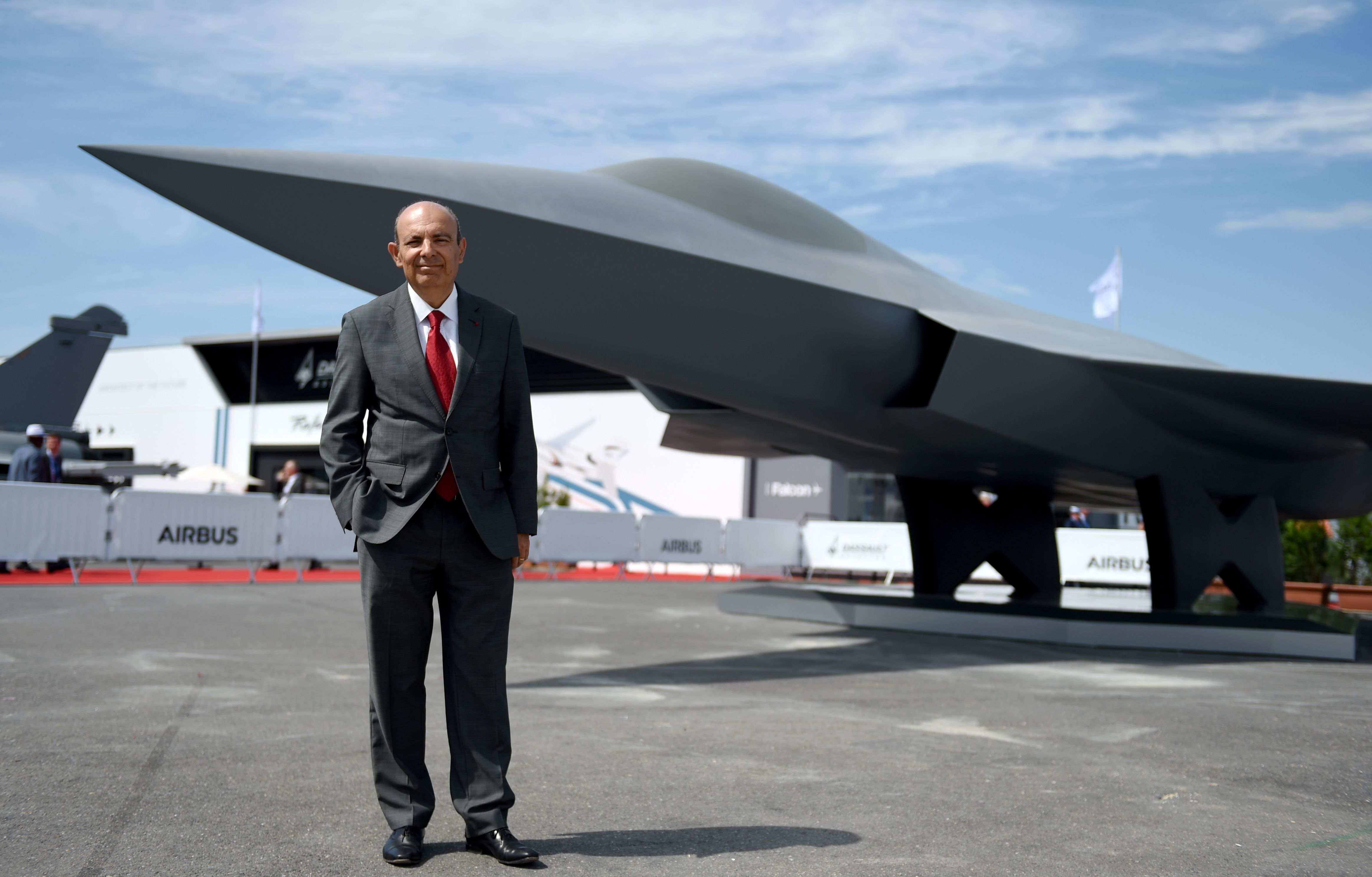 French group Dassault Aviation Chief Executive Eric Trappier poses in front of the full-scale model of the Systeme de Combat Aerien Futur (SCAF), the Future Combat Air System (FCAS) on the Dassault Aviation's static display during the International Paris Air Show on June 18, 2019 at Le Bourget Airport, near Paris. (Photo by ERIC PIERMONT / AFP) (Photo by ERIC PIERMONT/AFP via Getty Images)