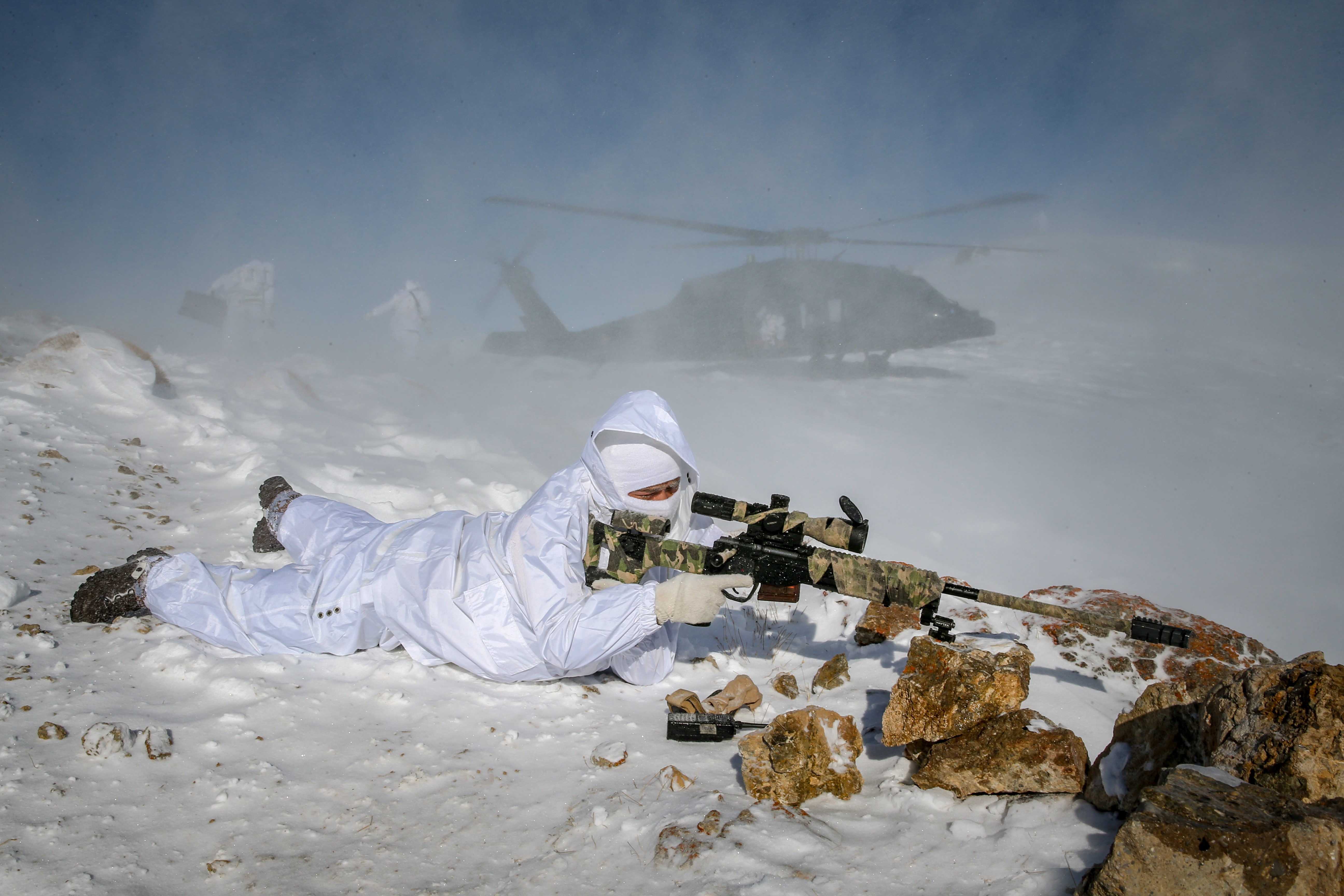 VAN, TURKEY - JANUARY 16: A military helicopter is seen as Turkish soldiers conduct a military operation to combat PKK, listed as a terrorist organization by Turkey, the U.S. and the EU, and Syrian Kurdish YPG militia, which Turkey regards as a terror group, during cold weather, below minus 20 degrees Celsius, at winter season, in Calyan tableland of Van, Turkey on January 16, 2020. 14 teams of 200 people consisting of commando and gendarmerie special operations participated in the operation. The soldiers were transported to the operation area with helicopters. This operation aims to decipher the activities of the terrorist organizations in the region. (Photo by Ozkan Bilgin/Anadolu Agency via Getty Images)