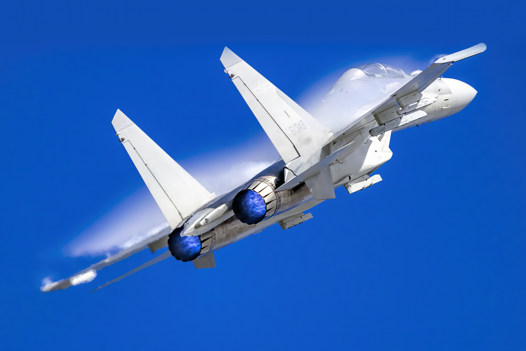 CHANGCHUN, CHINA - AUGUST 27: A J-16 multirole strike fighter performs in the sky during Changchun Air Show at Changchun Dafangshen Airport on August 27, 2022 in Changchun, Jilin Province of China. (Photo by VCG/VCG via Getty Images)