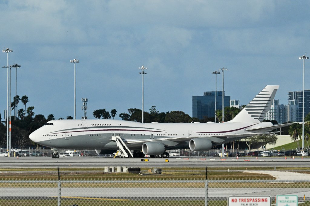 In this February 15, 2025 a Qatari Boeing 747 sits on the tarmac of Palm Beach International airport after US President Donald Trump toured the aircraft on February 15, 2025. Donald Trump plans to accept a luxury Boeing jet from the Qatari royal family for use as Air Force One and then continue flying in it after his tenure, despite strict rules on US presidential gifts, media reported May 11, 2025. Calling the plane a "flying palace," ABC News, which first reported the story, said the Boeing 747-8 jumbo jet would possibly be the most expensive gift ever received by the American government. (Photo by ROBERTO SCHMIDT / AFP) (Photo by ROBERTO SCHMIDT/AFP via Getty Images)