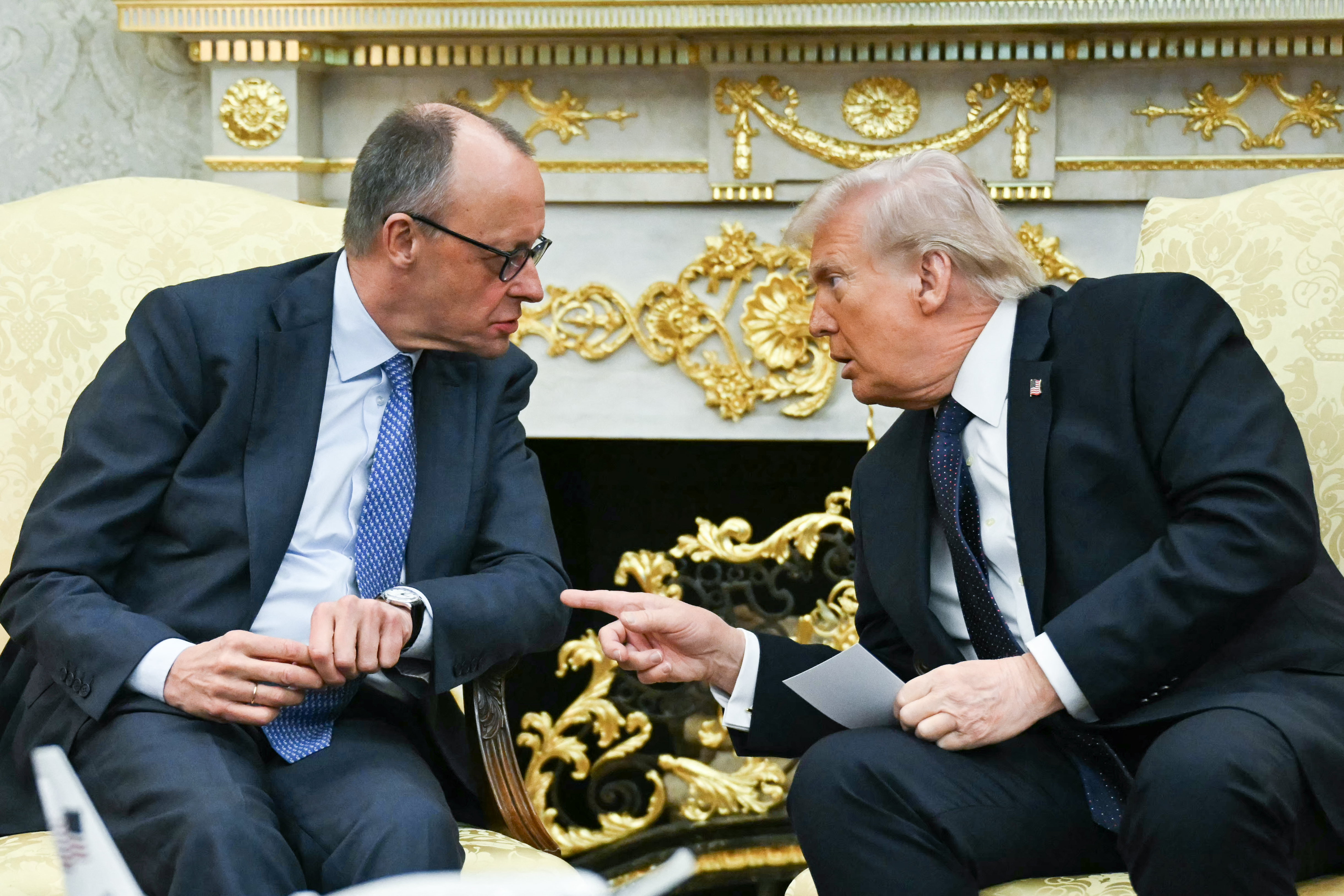 TOPSHOT - US President Donald Trump meets with German Chancellor Friedrich Merz in the Oval Office of the White House in Washington, DC on March 3, 2026. Chancellor Merz is the first European leader to visit President Trump since the United States and Israel launched their war against Iran. (Photo by ANDREW CABALLERO-REYNOLDS / AFP via Getty Images)