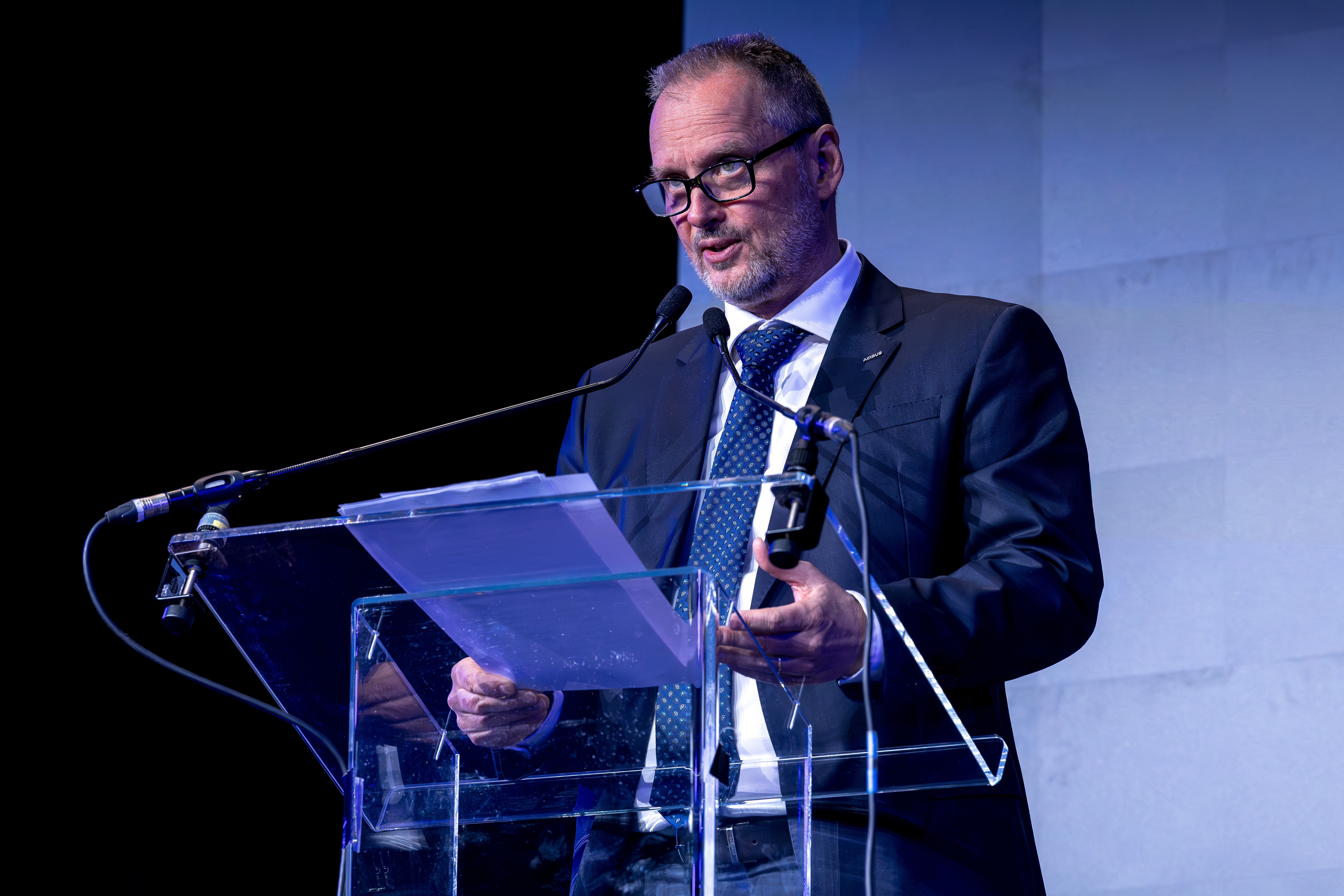 BRUSSELS, BELGIUM - MARCH 13: Michael Schoellhorn, CEO of Airbus Defence and Space, speak during a keynote conference at the inaugural edition of the Brussels European Defence Exhibition & Conference (BEDEX) on March 13, 2026 in Brussels, Belgium. The new BEDEX event has been created in partnership with the Belgian Ministry of Defence and Armed Forces to showcase the European and NATO defence industries, as Belgium and other European countries increase defence spending in response to the current geopolitical climate. (Photo by Omar Havana/Getty Images)