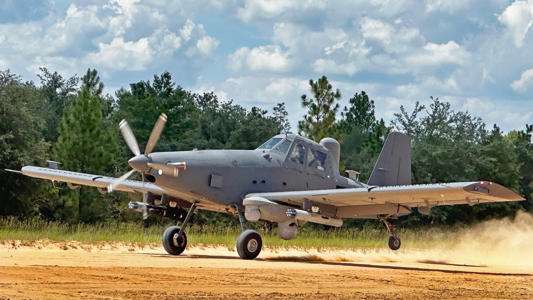 An OA-1K Skyraider II comes in for a landing on a dirt path July 10 on the Eglin Air Force Base, Florida range. The new Air Force Special Operations Command aircraft continues developmental testing with the 96th Test Wing and the U.S. Special Operations Command at Eglin.