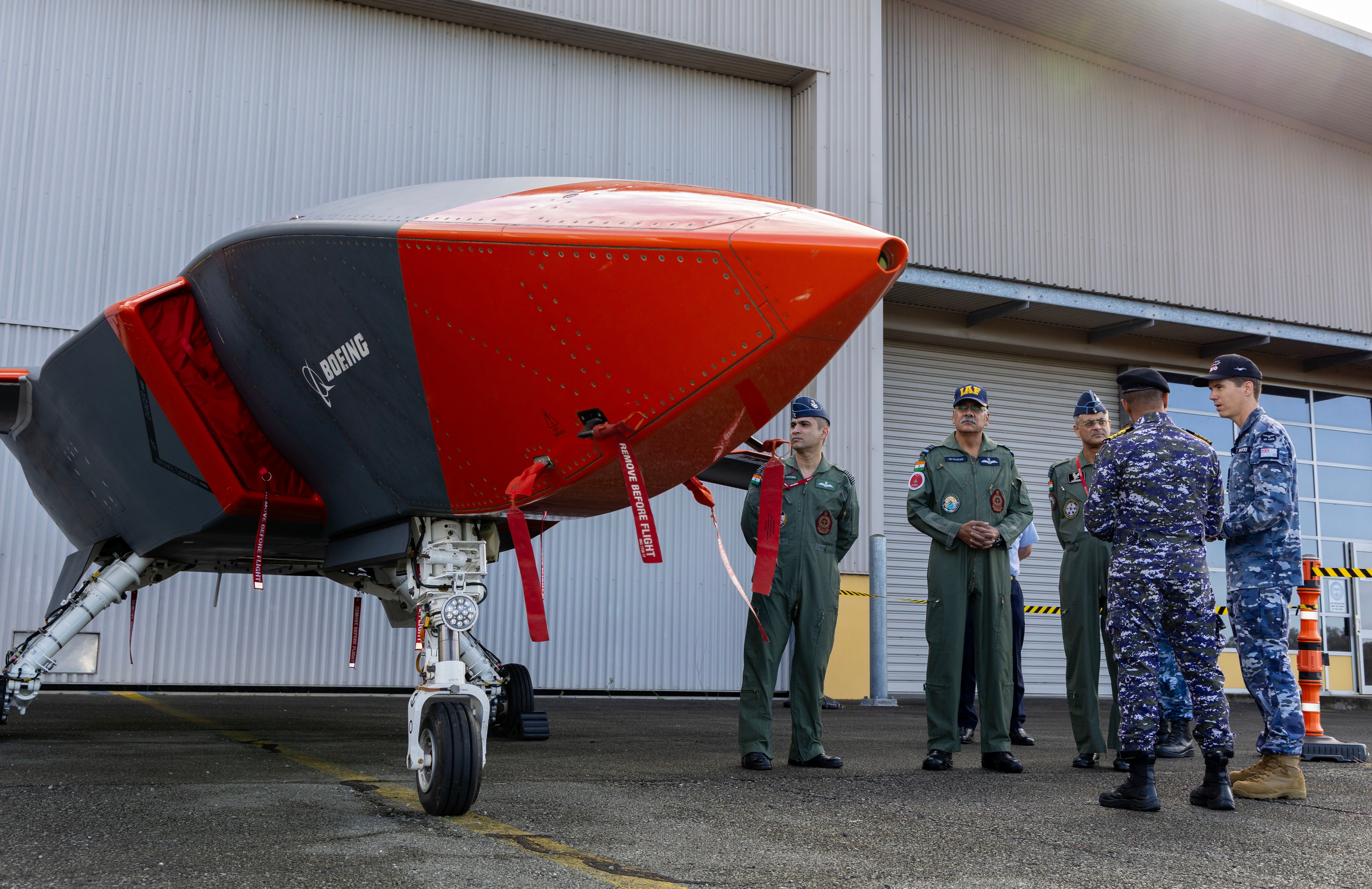 MQ-28 Engineering Manager, Wing Commander Rupert Walker, briefs the personnel from the Indian Air Force about the MQ-28A Ghost Bat during a visit to RAAF Base Amberley, Queensland. *** Local Caption *** Deputy Chief of Air Force, Air Vice-Marshal Steven Pesce, AM, hosted Air Vice-Marshal Sanjeev Taliyan of the Indian Air Force during a bilateral visit aimed at strengthening Australia's defence relationship with India through professional dialogue on air operations. The engagement highlighted Australian capabilities in air logistics support, airborne and special operations, VIP transport, air-to-air refuelling, search and survivor assistance, and aeromedical evacuation, with participation from representatives from the Heavy Air Lift Systems Program Office (HALSPO) and 86 Wing Units 33 Squadron and 36 Squadron. The visit reaffirms India is a top tier defence partner for Australia. It highlights the hard work between our aviators to foster and strengthen relationships in pursuit of deepening interoperability. This includes supporting shared understanding, trust-building between subject matter experts, and identifying opportunities for enhanced cooperation. Such engagements strengthen our defence partnership in support of regional security.
