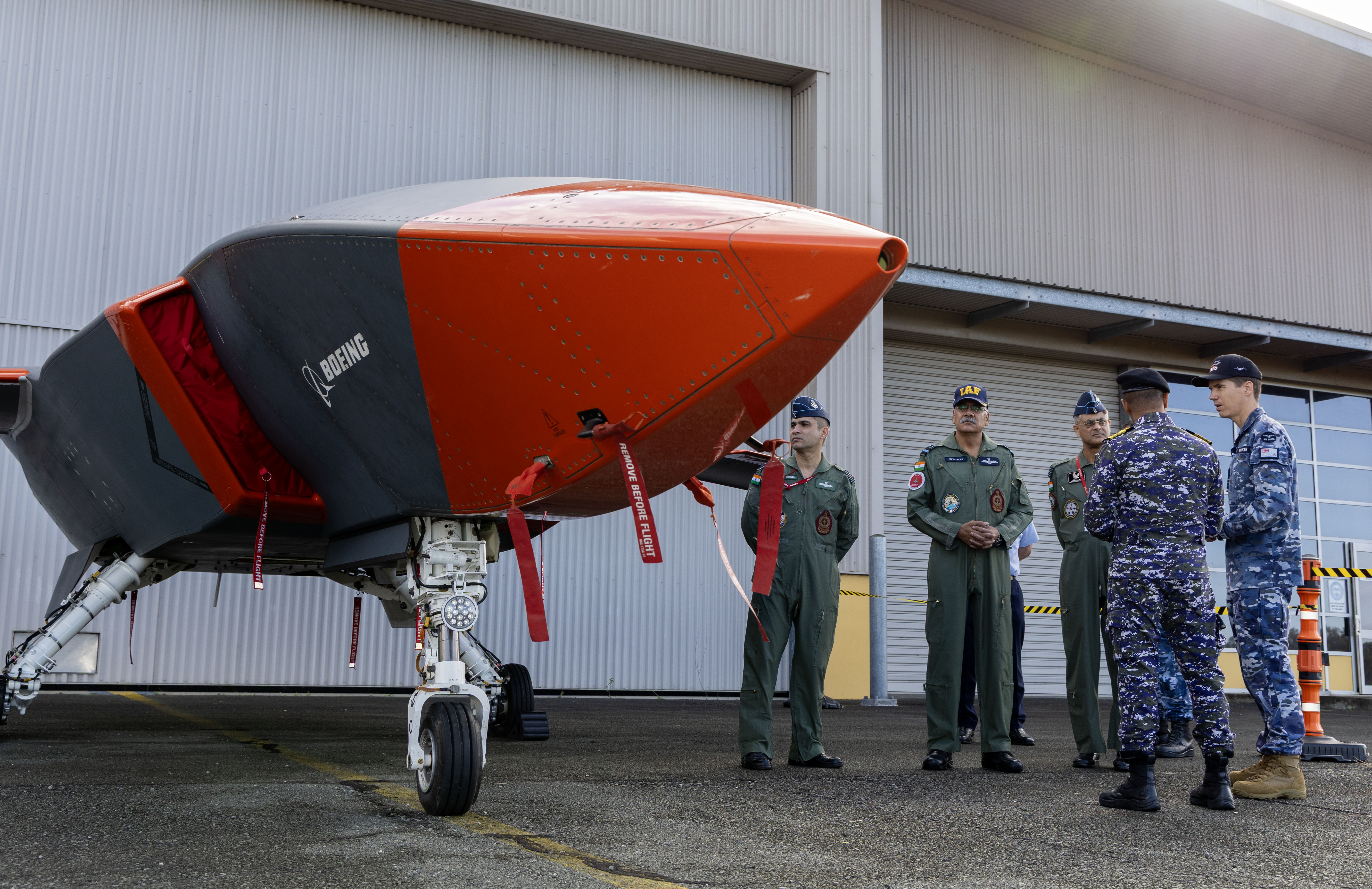 MQ-28 Engineering Manager, Wing Commander Rupert Walker, briefs the personnel from the Indian Air Force about the MQ-28A Ghost Bat during a visit to RAAF Base Amberley, Queensland. *** Local Caption *** Deputy Chief of Air Force, Air Vice-Marshal Steven Pesce, AM, hosted Air Vice-Marshal Sanjeev Taliyan of the Indian Air Force during a bilateral visit aimed at strengthening Australia's defence relationship with India through professional dialogue on air operations. The engagement highlighted Australian capabilities in air logistics support, airborne and special operations, VIP transport, air-to-air refuelling, search and survivor assistance, and aeromedical evacuation, with participation from representatives from the Heavy Air Lift Systems Program Office (HALSPO) and 86 Wing Units 33 Squadron and 36 Squadron. The visit reaffirms India is a top tier defence partner for Australia. It highlights the hard work between our aviators to foster and strengthen relationships in pursuit of deepening interoperability. This includes supporting shared understanding, trust-building between subject matter experts, and identifying opportunities for enhanced cooperation. Such engagements strengthen our defence partnership in support of regional security.