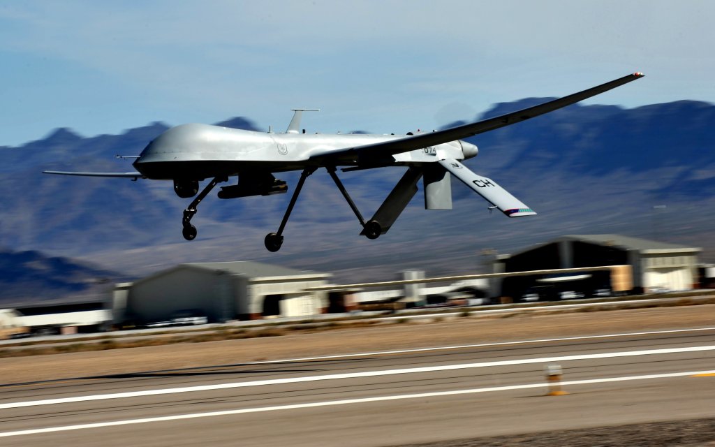 An MQ-1 Predator flies above the flight line during launch and recovery training at Creech Air Force Base, Nev. Aircrew will fly the MQ-1 for the final time at Creech on March 9, 2018 before it is officially retired from the Air Force inventory. (U.S. Air Force photo by Senior Master Sgt. Cecilio Ricardo)
