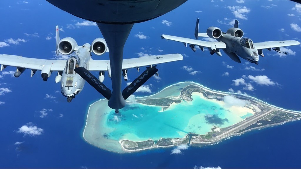 Two 74th Fighter Squadron A-10C Thunderbolt II aircraft prepare to aerial refuel above Wake Island, 23 Oct. 2022. These aircraft transited from Moody Air Force Base, Georgia, to Andersen AFB, Guam, to participate in a Dynamic Force Employment Operation which is designed as a way for Pacific Air Forces to exercise their ability to generate combat air power from dynamic force elements while continuing to move, maneuver, and sustain these elements in geographically-separated and contested environments. (U.S. Air Force courtesy photo by Tech. Sgt. Eileen Adams)