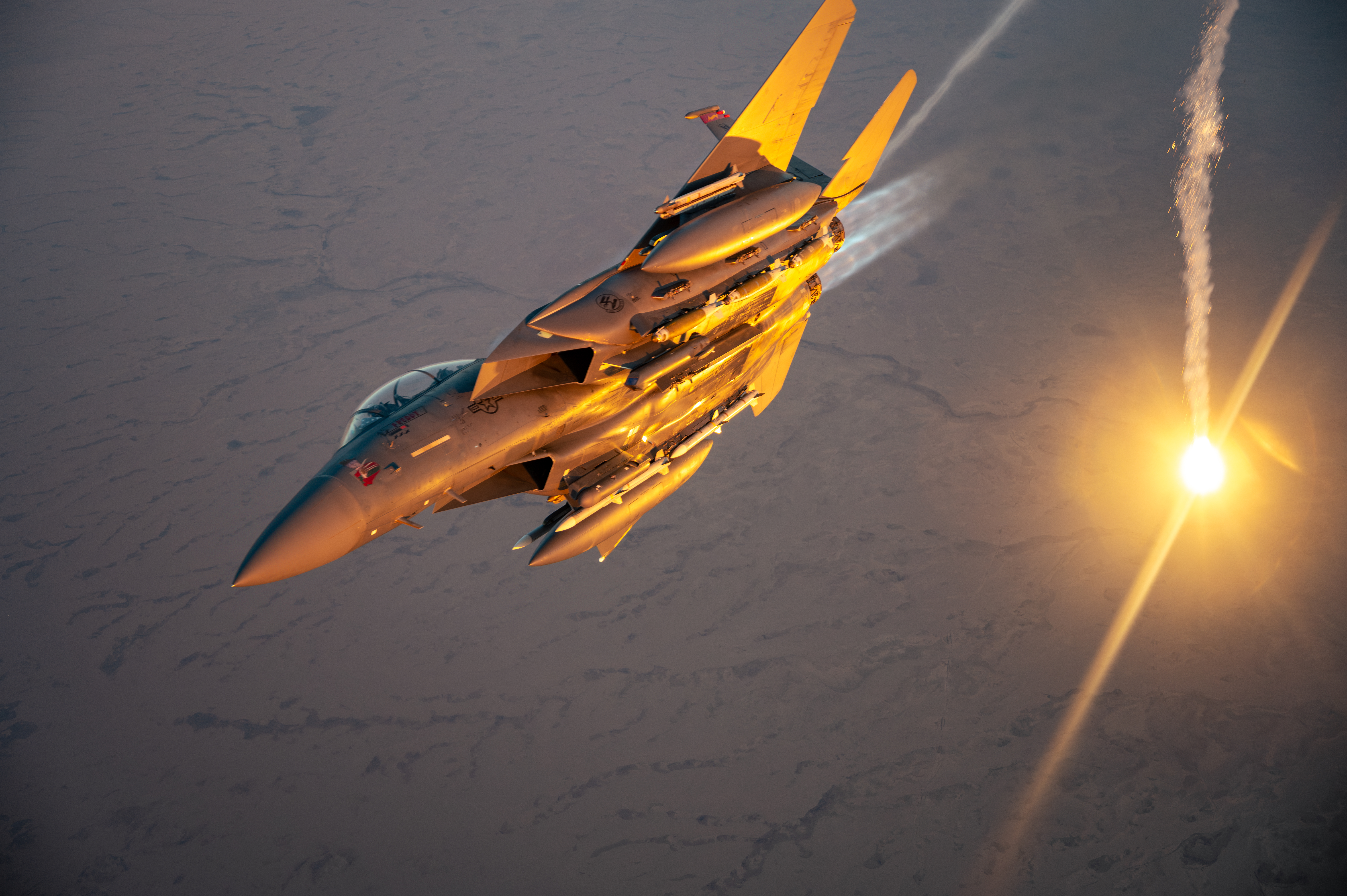 A U.S. Air Force F-15E Strike Eagle performs a flare check over the U.S. Central Command area of responsibility, March 9, 2025. The F-15E is deployed within the CENTCOM AOR to help defend U.S. interests, promote regional security, and deter aggression in the region. (U.S. Air Force photo by Senior Airman Zachary Willis)