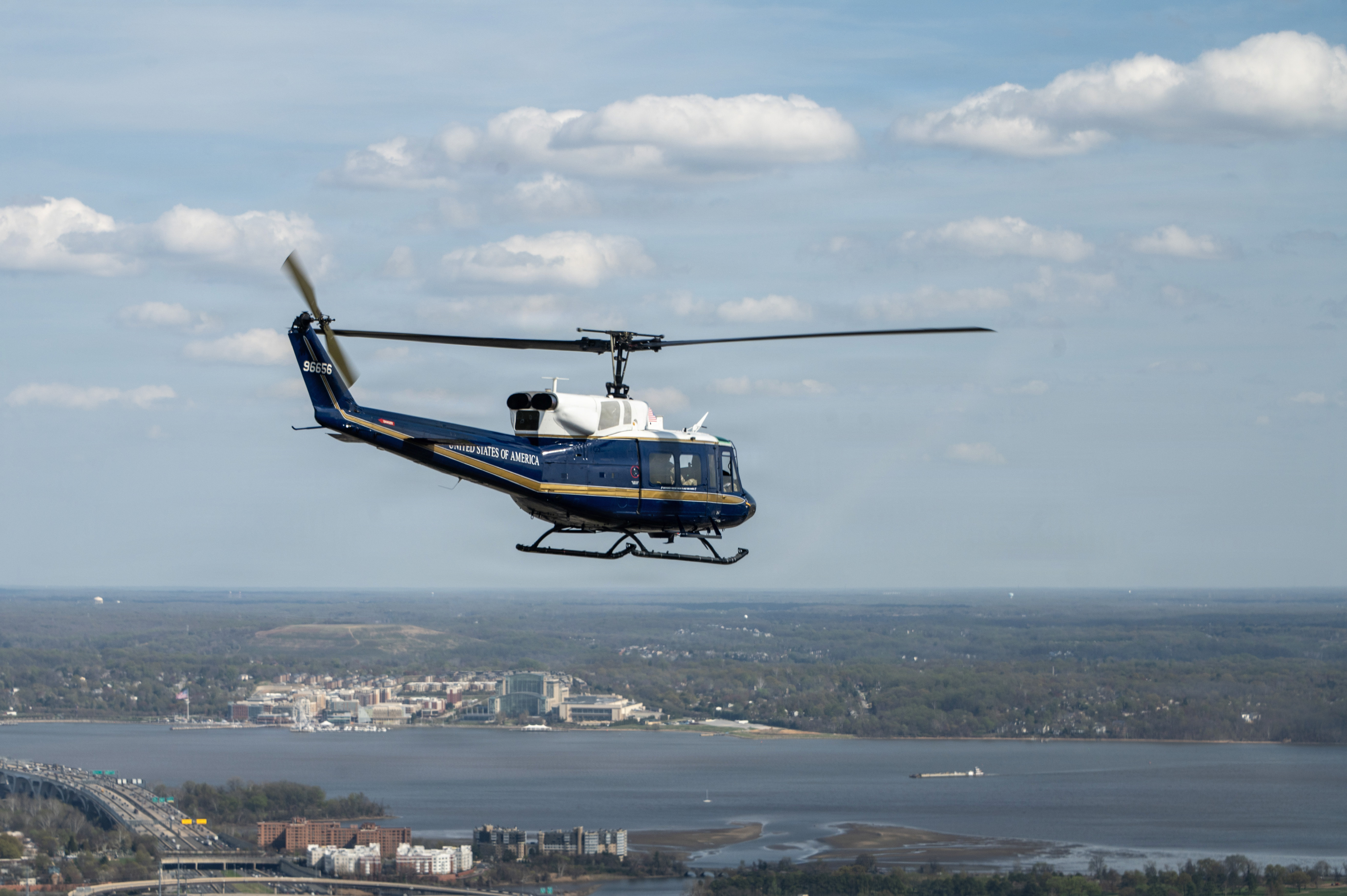 A UH-1N Huey assigned to the 1st Helicopter Squadron at Joint Base Andrews, Maryland, flies over Washington, D.C., during training, March 31, 2026. The 1st HS conducts rotary-wing airlift, security, and contingency operations supporting the National Capital Region. (U.S. Air Force photo by Staff Sgt. Aubree Owens)