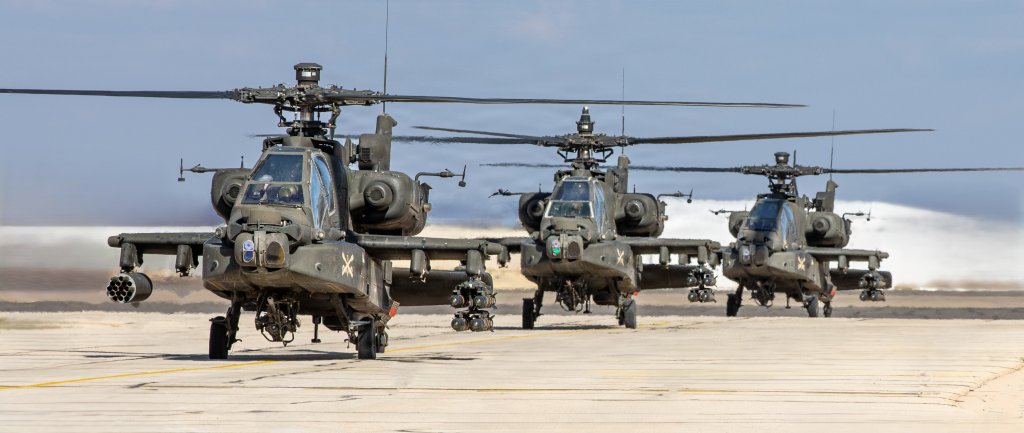 A flight of U.S. Army AH-64 Apache attack helicopters, armed with rockets and Hellfire missiles, taxi out to conduct a scheduled flight in the U.S. Central Command area of responsibility. In addition to rockets and missiles, the Apache is additionally armed with a 30mm chain gun. (U.S. Army photo)