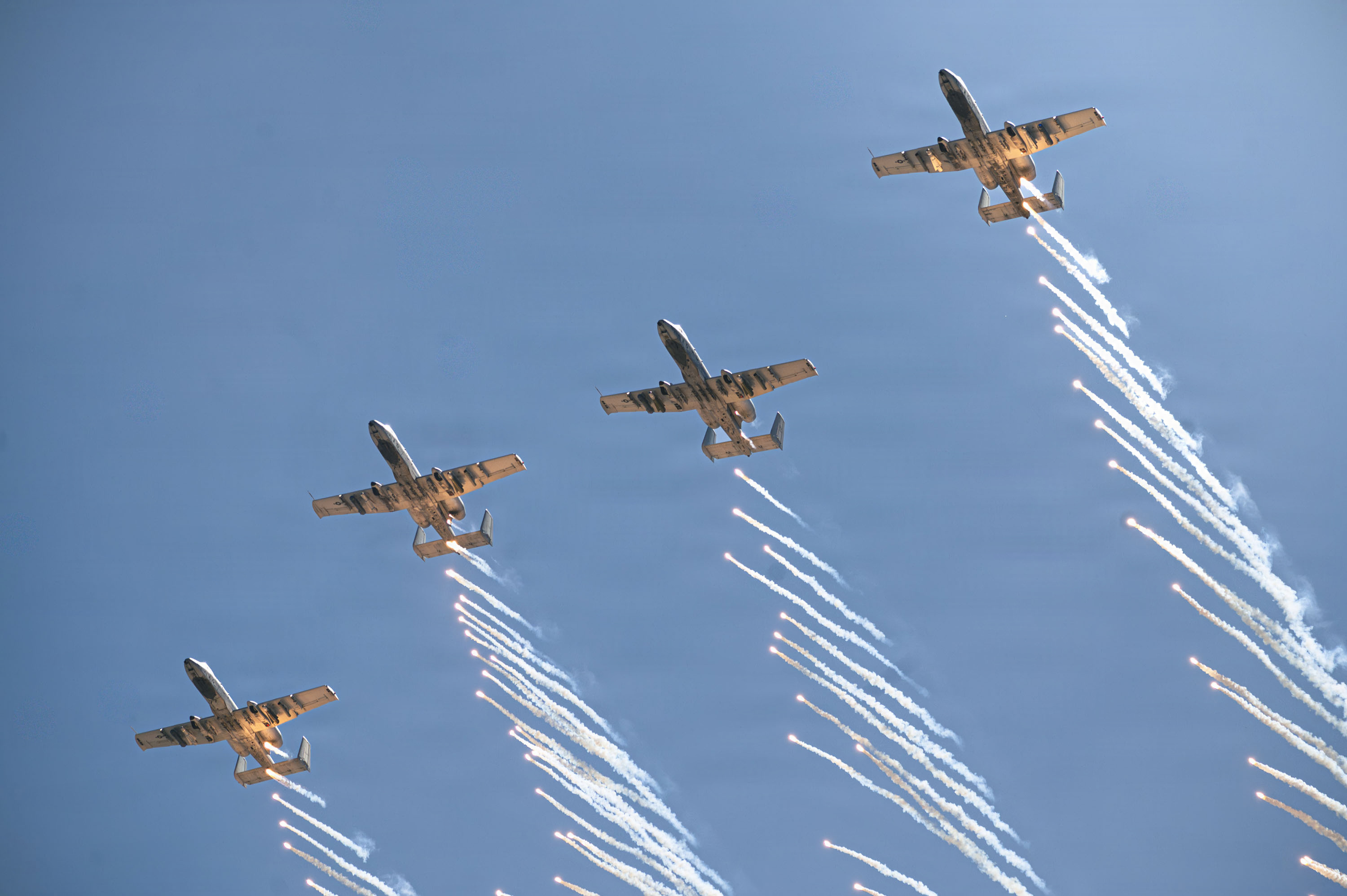 Four U.S. Air Force A-10C Thunderbolt II aircraft assigned to the 357th Fighter Squadron deploy flares over a training range near Gila Bend, Arizona, May 1, 2026. The training demonstration highlighted the aircraft’s defensive countermeasure capabilities, enhancing survivability in contested environments. (U.S. Air Force photo by Airman 1st Class Samantha Melecio)
