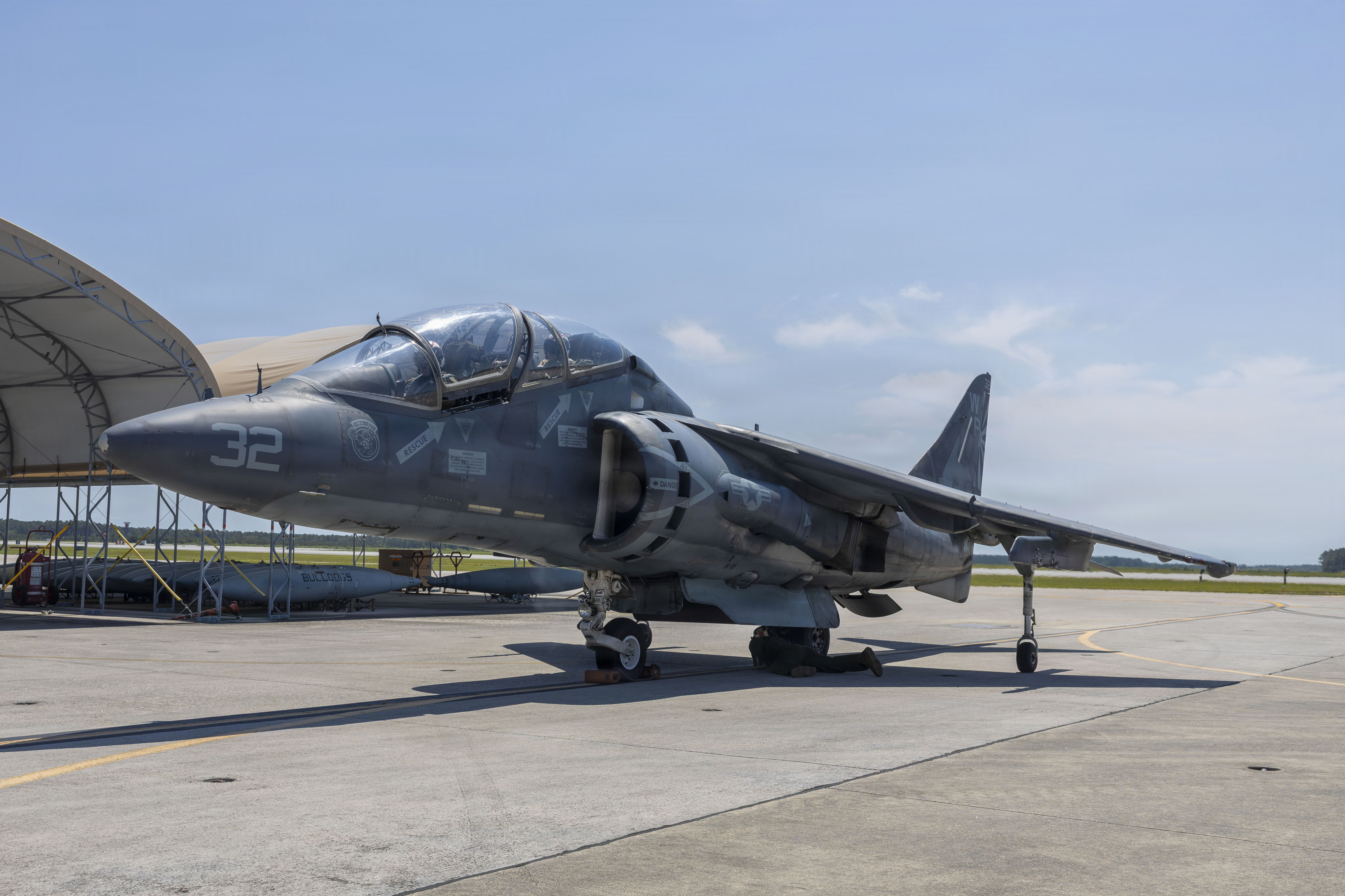 U.S. Marine Corps Maj. Eric Shiebe, left, from Georgia, an AV-8B Harrier pilot and executive officer, and Sgt. Tatiana Rios, right, from Wisconsin, a fixed wing aircraft airframe mechanic, both with Marine Attack Squadron (VMA) 223, Marine Aircraft Group 14, 2nd Marine Aircraft Wing, participate in an incentive flight at Marine Corps Air Station Cherry Point, North Carolina, May 19, 2026. Incentive flights provide an opportunity for Marines within the squadron to ride in the back of a TAV-8B Harrier II as a reward for exceptional job performance. (U.S. Marine Corps photo by Lance Cpl. Bryan Giraldo)