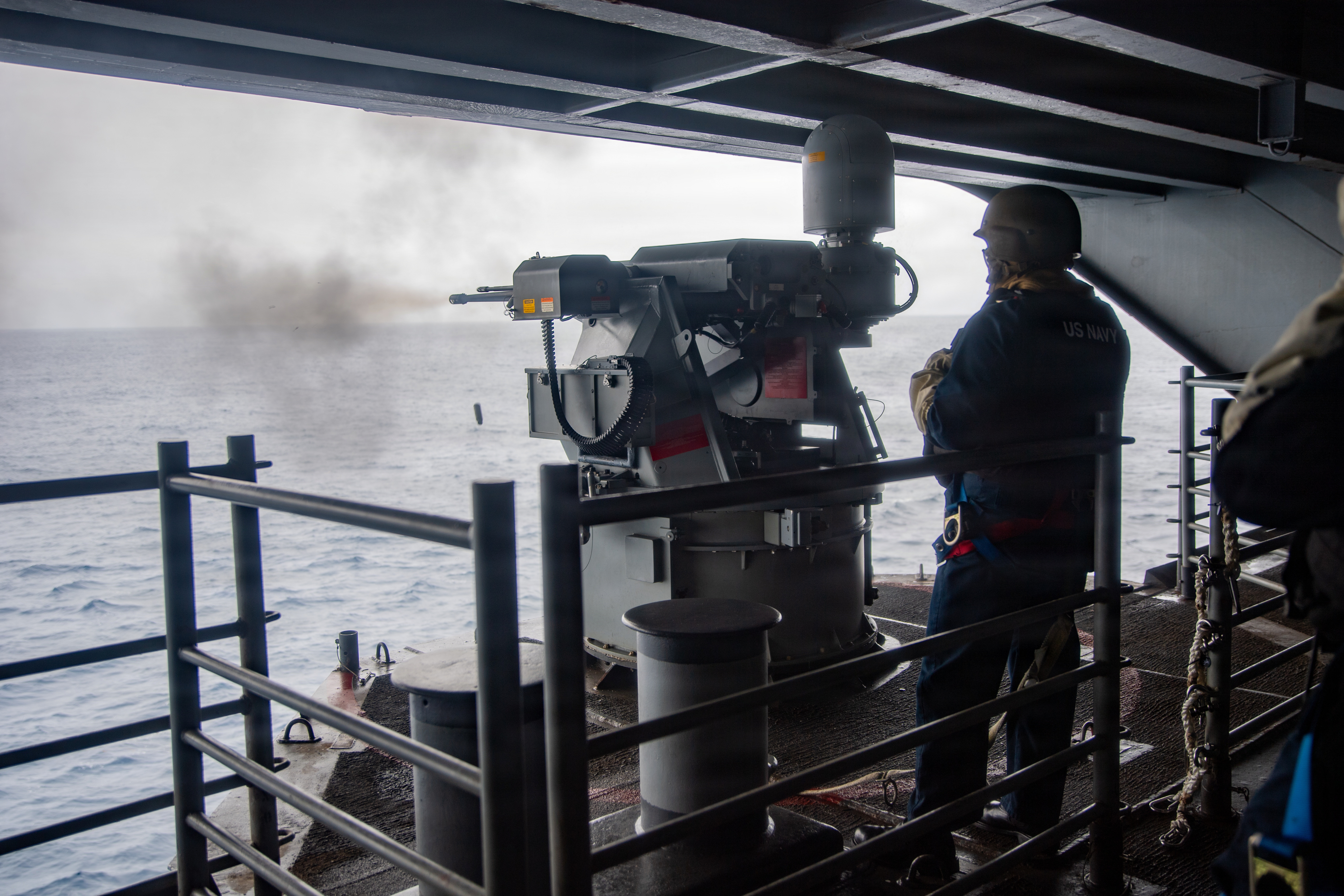 PACIFIC OCEAN (June 10, 2026) – U.S. Navy Aviation Ordnanceman 3rd Class Joshua Harrington observes an Mk. 38 25mm machine gun fire during a live-fire exercise aboard the Nimitz-class aircraft carrier USS Theodore Roosevelt (CVN 71), June 10, 2026. Theodore Roosevelt, flagship of Carrier Strike Group (CSG) 9, is underway conducting exercises to bolster strike group readiness and capability in the U.S. 3rd Fleet area of operations. (U.S. Navy photo by Mass Communication Specialist Seaman Devin Kraemer)