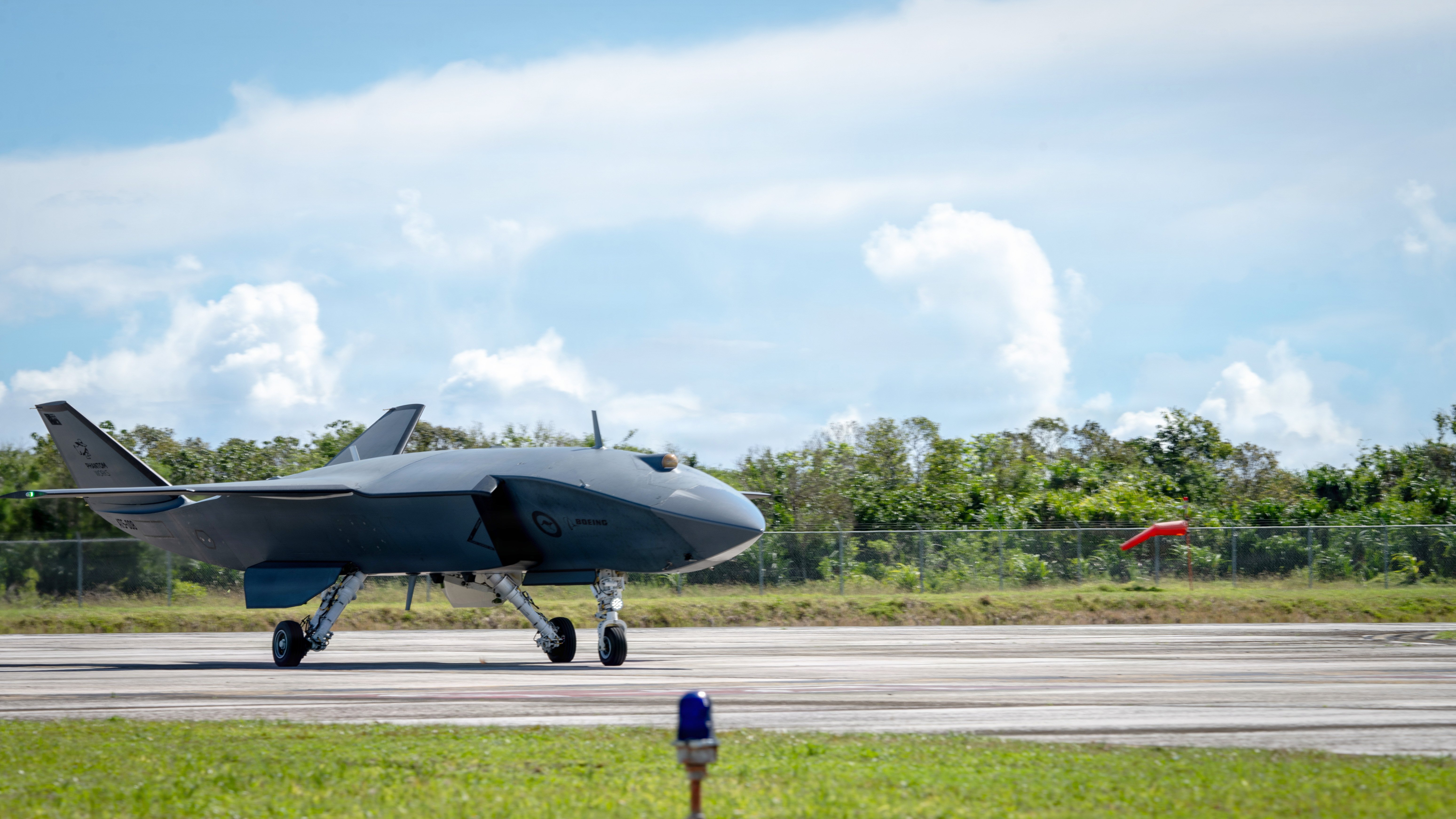 A Boeing Defence Australia’s MQ-28 Ghost Bat, a production representative test aircraft, returns from a taxi test during Exercise Valiant Shield 2026 at Rota, Commonwealth of the Northern Mariana Islands, June 21, 2026. Valiant Shield is a biennial, multinational, joint exercise focused on integrating the joint force in a multi-domain environment. (U.S. Air Force photo by Senior Airman Adrien Tran)