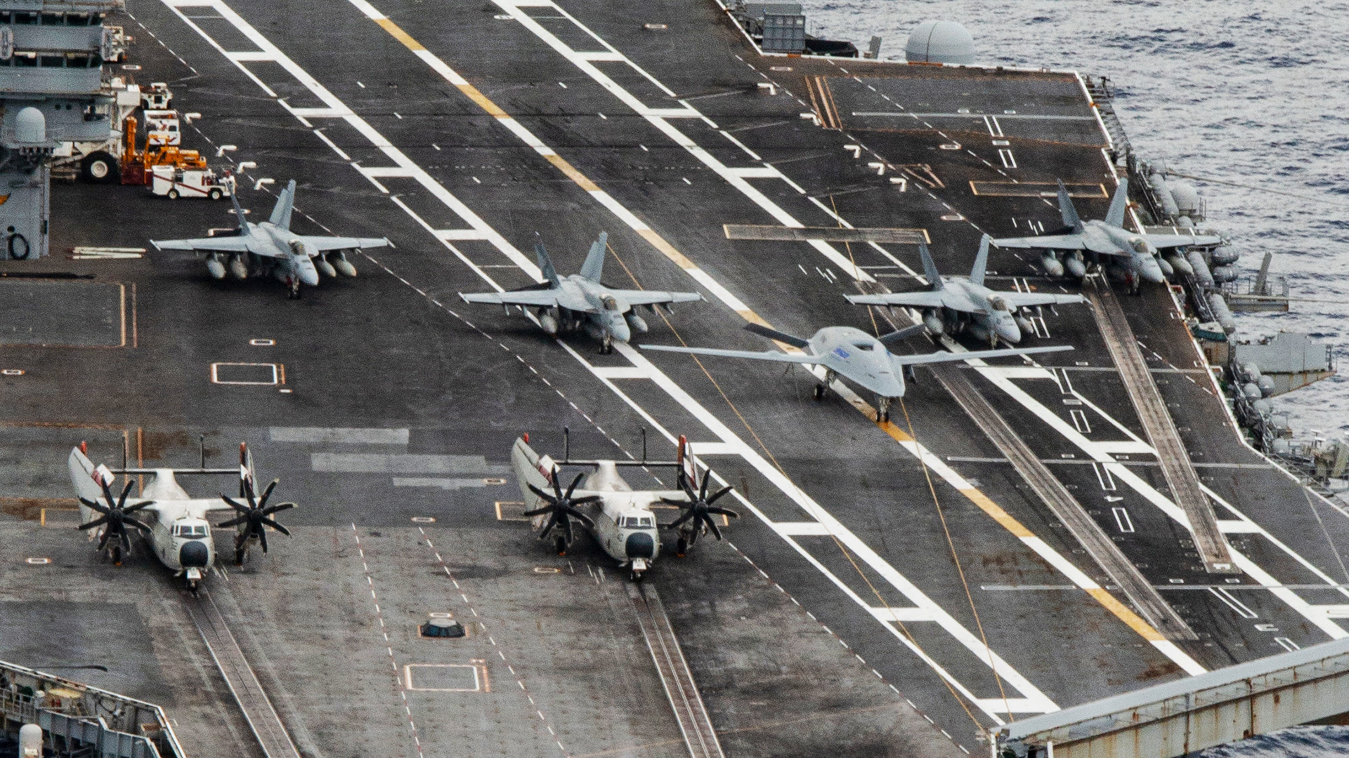 Twenty-six ships from 13 partner and allied nations steam in formation with Nimitz-class aircraft carrier USS Nimitz (CVN 68) as part of Fleet Exercise (FLEETEX) 250 in the Atlantic Ocean, June 25, 2026. Nimitz is underway taking part in Fleet Exercise (FLEETEX) 250, a series of structured multilateral training events at-sea, aimed at building cohesiveness, validating tactical procedures, and strengthening the interoperability of participating units—which include warships, aircraft, and crews from the U.S. and 13 partner and allied nations. (U.S. Navy photo by Mass Communication Specialist Seaman Johnathan McCune)