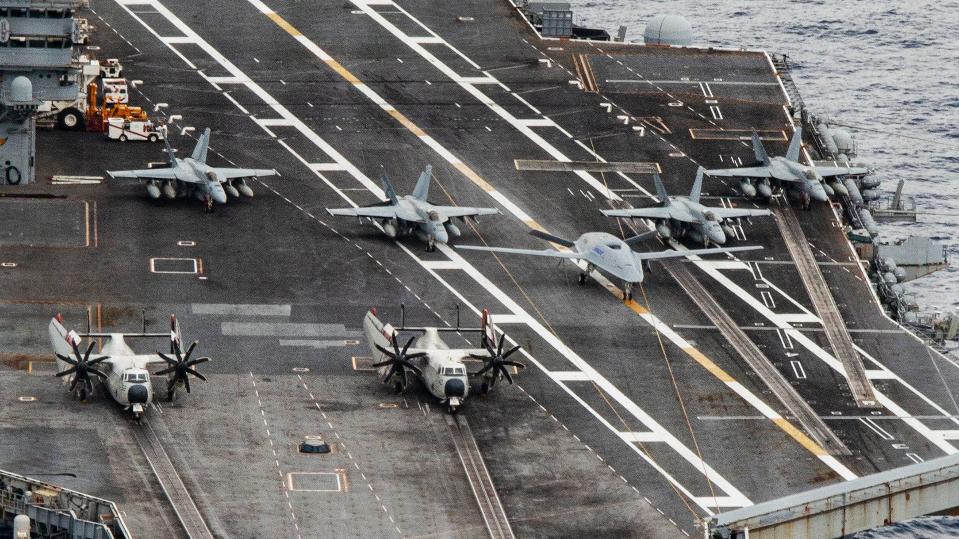 Twenty-six ships from 13 partner and allied nations steam in formation with Nimitz-class aircraft carrier USS Nimitz (CVN 68) as part of Fleet Exercise (FLEETEX) 250 in the Atlantic Ocean, June 25, 2026. Nimitz is underway taking part in Fleet Exercise (FLEETEX) 250, a series of structured multilateral training events at-sea, aimed at building cohesiveness, validating tactical procedures, and strengthening the interoperability of participating units—which include warships, aircraft, and crews from the U.S. and 13 partner and allied nations. (U.S. Navy photo by Mass Communication Specialist Seaman Johnathan McCune)