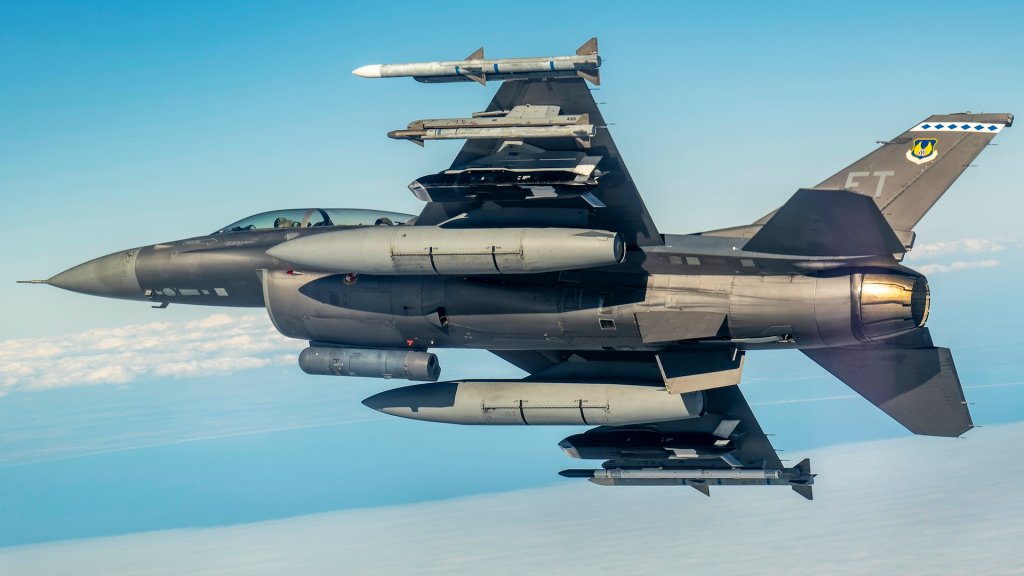 A U.S. Air Force F-16 Fighting Falcon flies over the Gulf of America. The F-16 carried two Family of Affordable Mass Munitions – Lugged weapons.