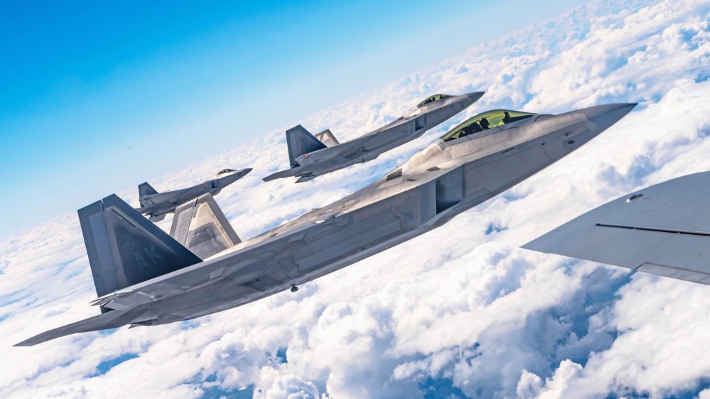 Three U.S. Air Force F-22 Raptor aircraft assigned to the 90th Fighter Squadron, Joint Base Elmendorf-Richardson, Alaska, fly alongside a U.S. Air Force KC-135 Stratotanker aircraft assigned to the 100th Air Refueling Wing at Royal Air Force Mildenhall, England, over Poland, Aug. 10, 2022. The NATO Air Shielding mission provides a near seamless shield from the Baltic to Black Seas, ensuring NATO Allies are better able to safeguard and protect Alliance territory, populations and forces from air and missile threat.