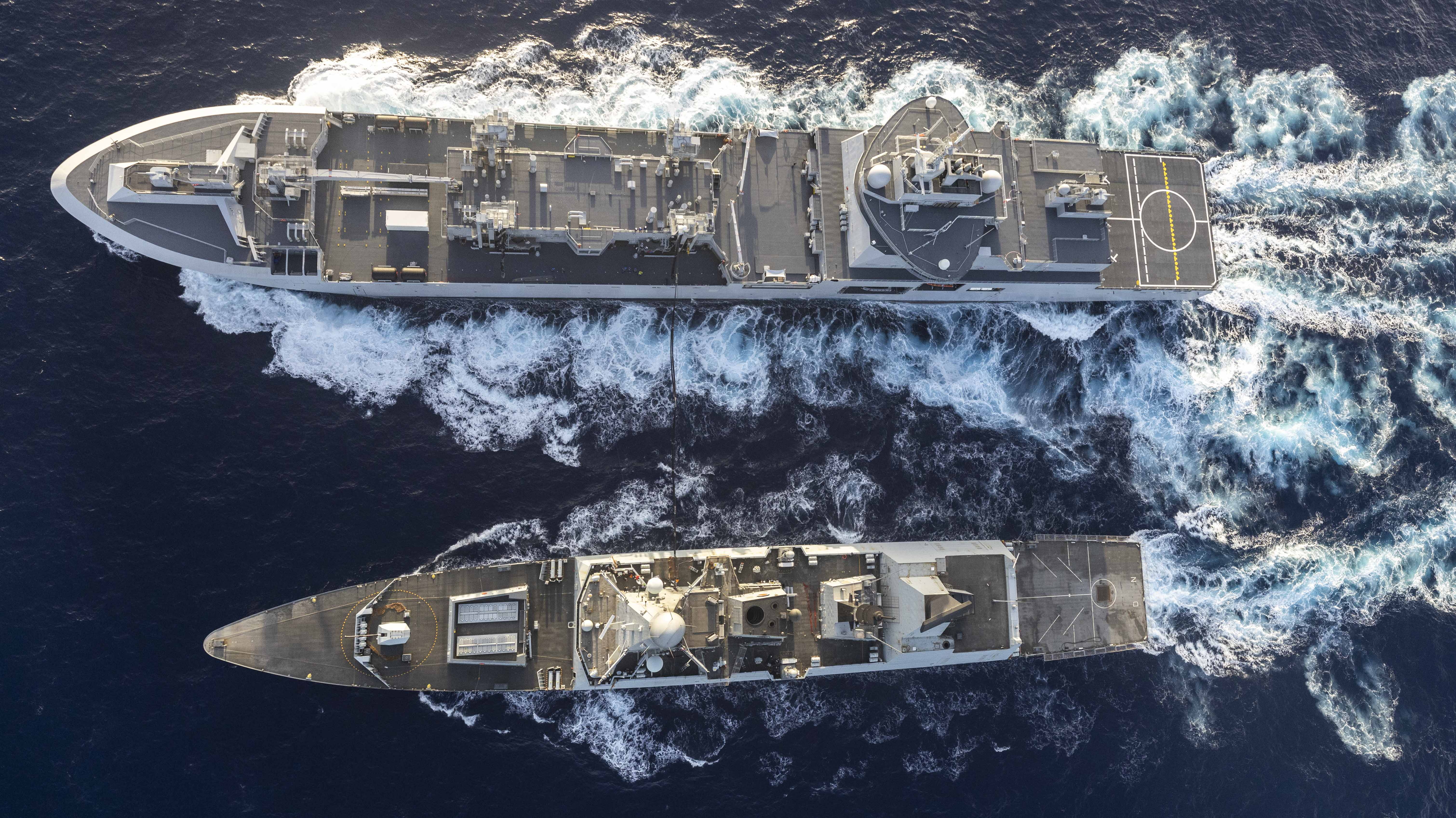 25 May 2026 - HMS Dragon (bottom) conducting Replenishment at Sea with French Navy Ship Jacques Chevallier-class LSS (top). HMS Dragon is currently operating in the Middle East ahead of her tasking to support freedom of navigation and ensure UK assets are safe in the region. HMS Dragon has embedded with the French CSG as part of the multinational coalition to support freedom of navigation and ensure the Strait of Hormuz are opened and remain safe for Merchant Vessels.