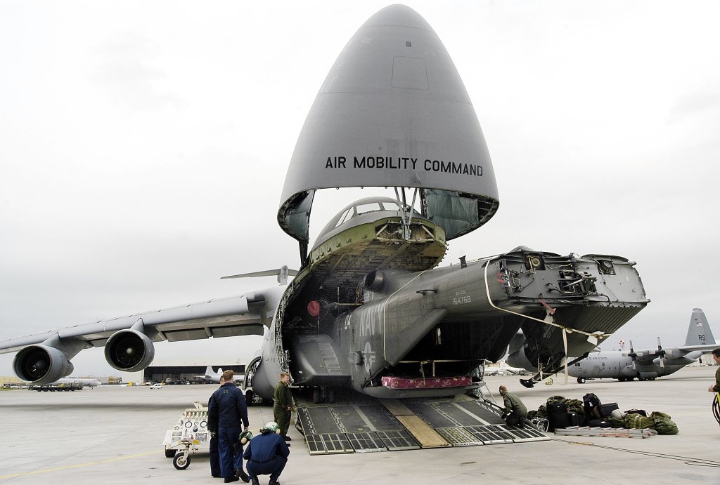 SIGONELLA, SICILY - MARCH 14: An MH-53E Sea Dragon assigned to the "Blackhawks" of Helicopter Mine Counter Measures Squadron 15 is offloaded from a U.S. Air Force C-5 Galaxy March 14, 2003 at the U.S. naval base at Sigonella, Sicily. The Sea Dragon is deployed in support of naval vessels in the Mediterranean Sea. The base provides logistical support for the Sixth Fleet and NATO forces when in the Mediterranean Sea. (Photo by Damon J. Moritz/U.S. Navy/Getty Images)